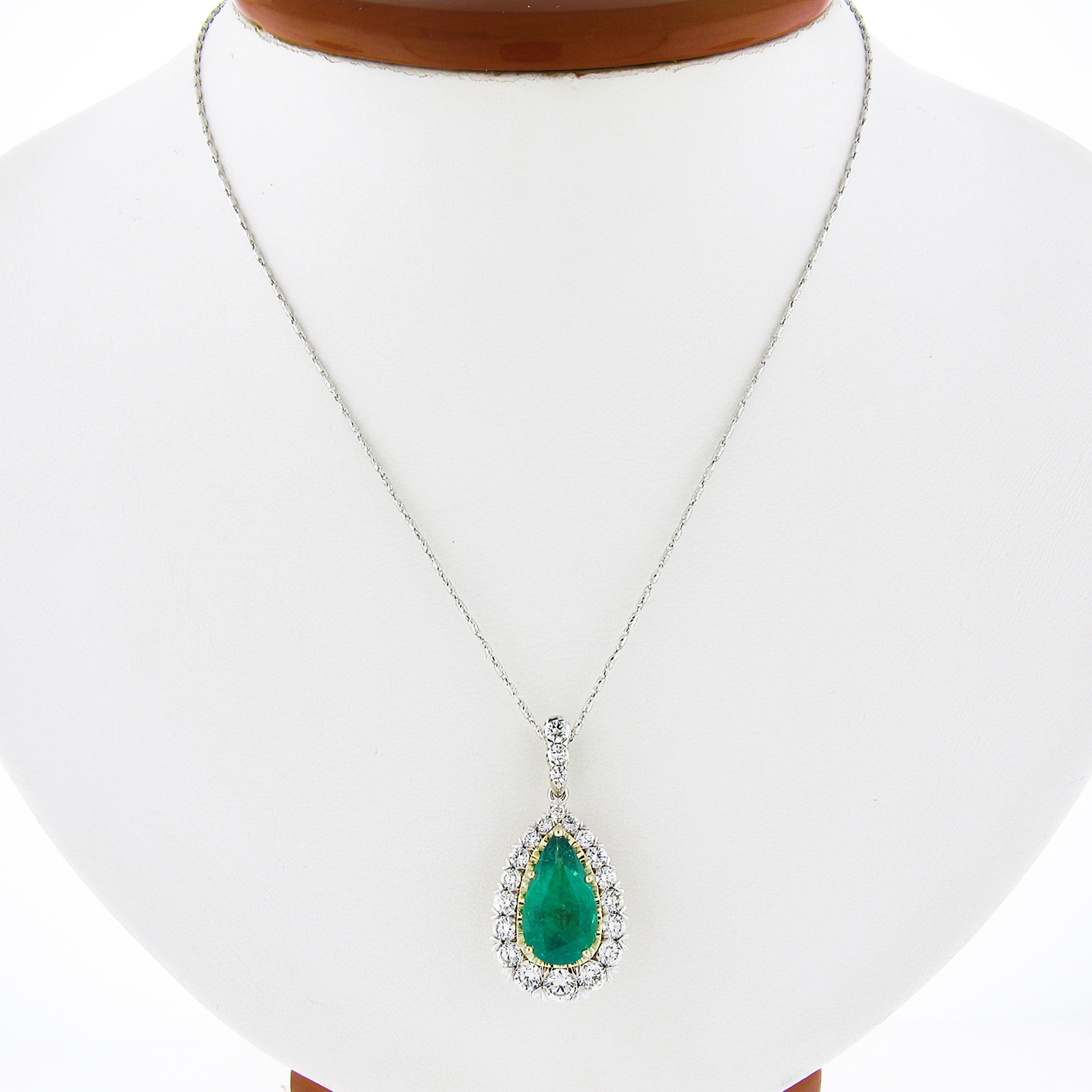 Here we have an absolutely magnificent and truly jaw dropping custom made pendant that is crafted from solid 18k white gold with a yellow gold center, carrying a gorgeous, GIA certified, natural emerald stone surrounded by a super fiery diamond halo