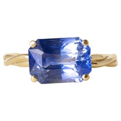 18K Gold 4.57 Carat Blue Sapphire Emerald Cut Twisted Band Solitaire