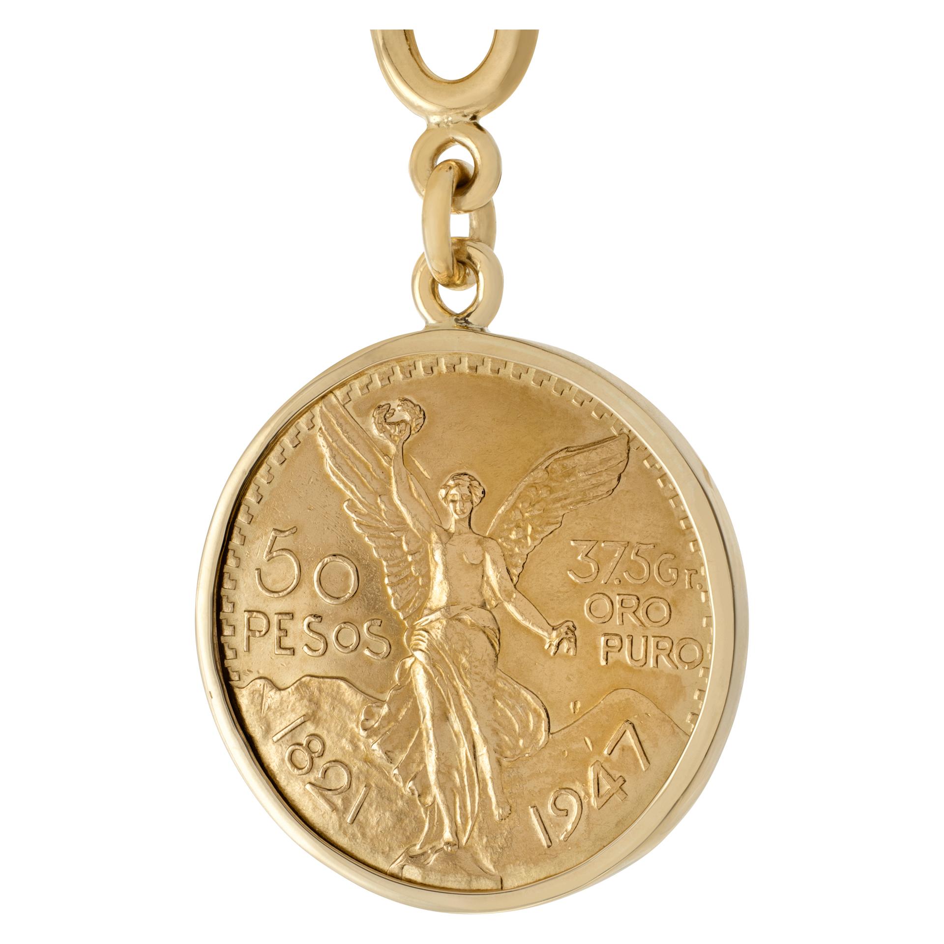50 pesos mexican coin and keychain in 18k gold. Coin has 1.2 ounces pure gold. Keychain and coin alone have gold value of approximately $3200.
