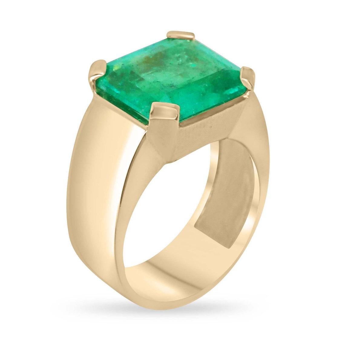 Elevate your style with our exquisite Men's Solitaire Colombian Emerald Pinky Ring. Featuring a stunning 5.16-carat emerald cut emerald sourced from the renowned Muzo mines of Colombia, this ring boasts a captivating vivid apple green color with a