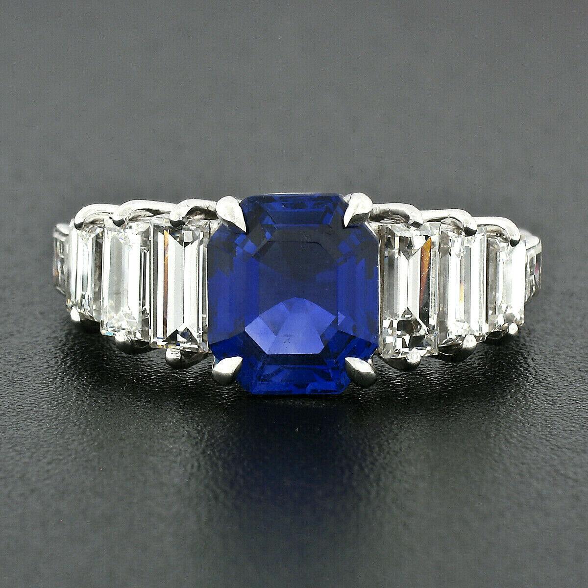 This absolutely breathtaking sapphire statement ring was crafted from solid 18k white gold. It features a magnificent, AGL certified, natural sapphire prong set at its center. This AGL certified Burma sapphire is gorgeous and displays the finest and