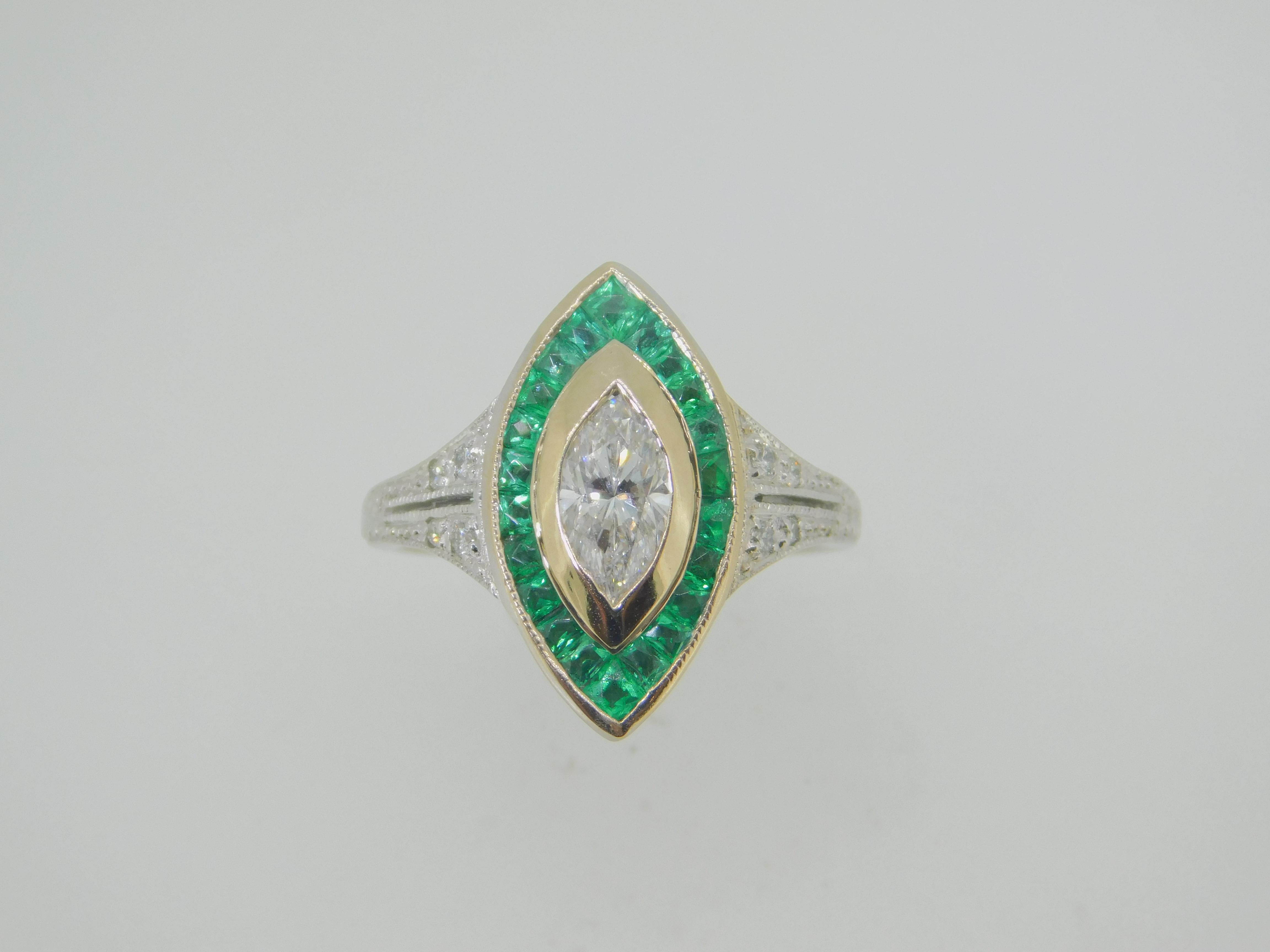 18k Gold .70ct Genuine Natural Diamond Ring with 1.5ct Emerald Halo (#J4110)

18k white gold diamond and emerald ring. The ring features a marquise shaped diamond weighing .70cts. There is a halo of twenty-two specialty calibre cut emeralds with a
