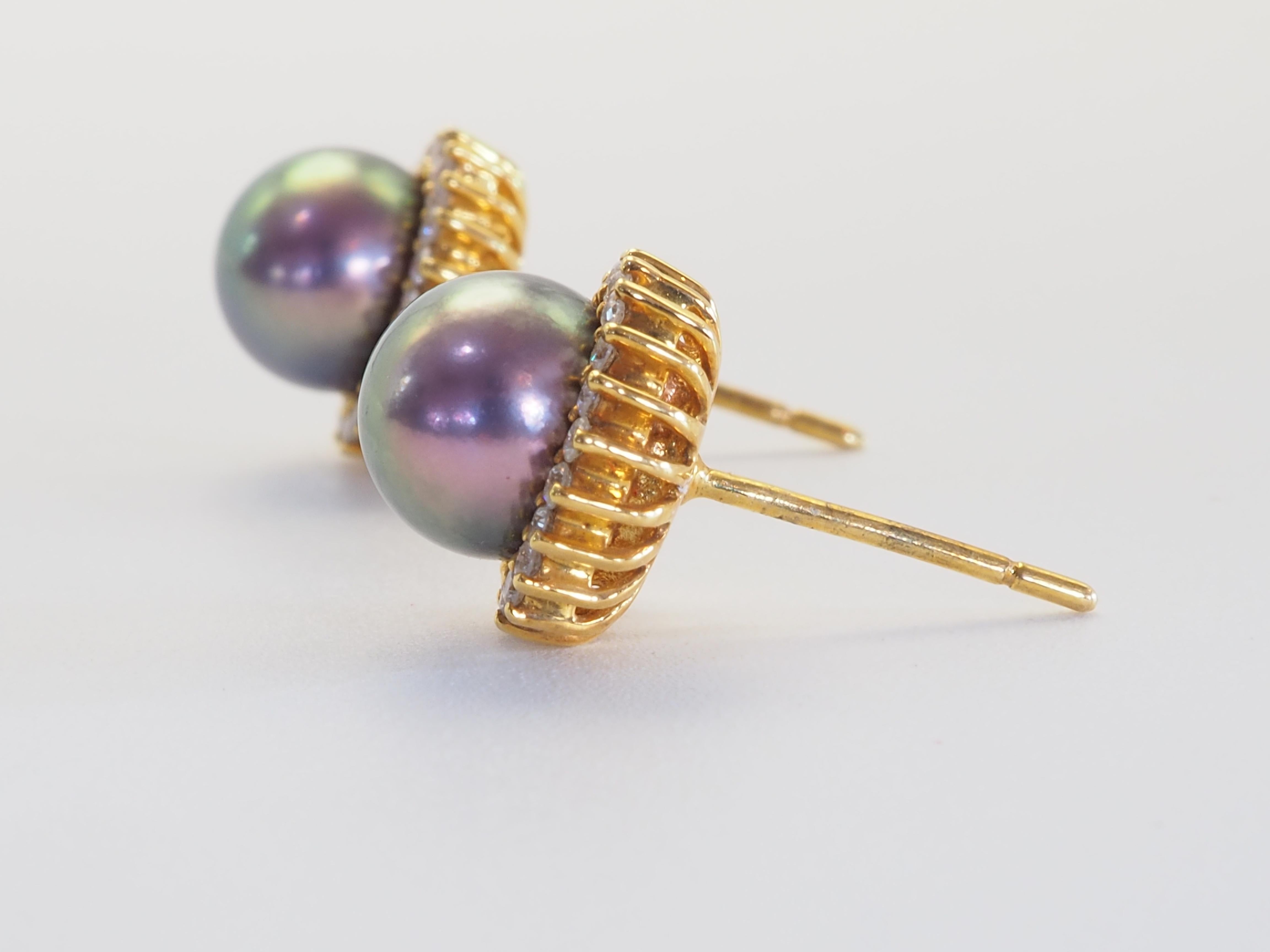A refined celebration of natural beauty and artisanal precision, these stud earrings feature two exquisite Tahitian pearls, each measuring approximately 7.8mm in diameter. Their deep grey body color and subtle purplish overtone evoke the mystery of