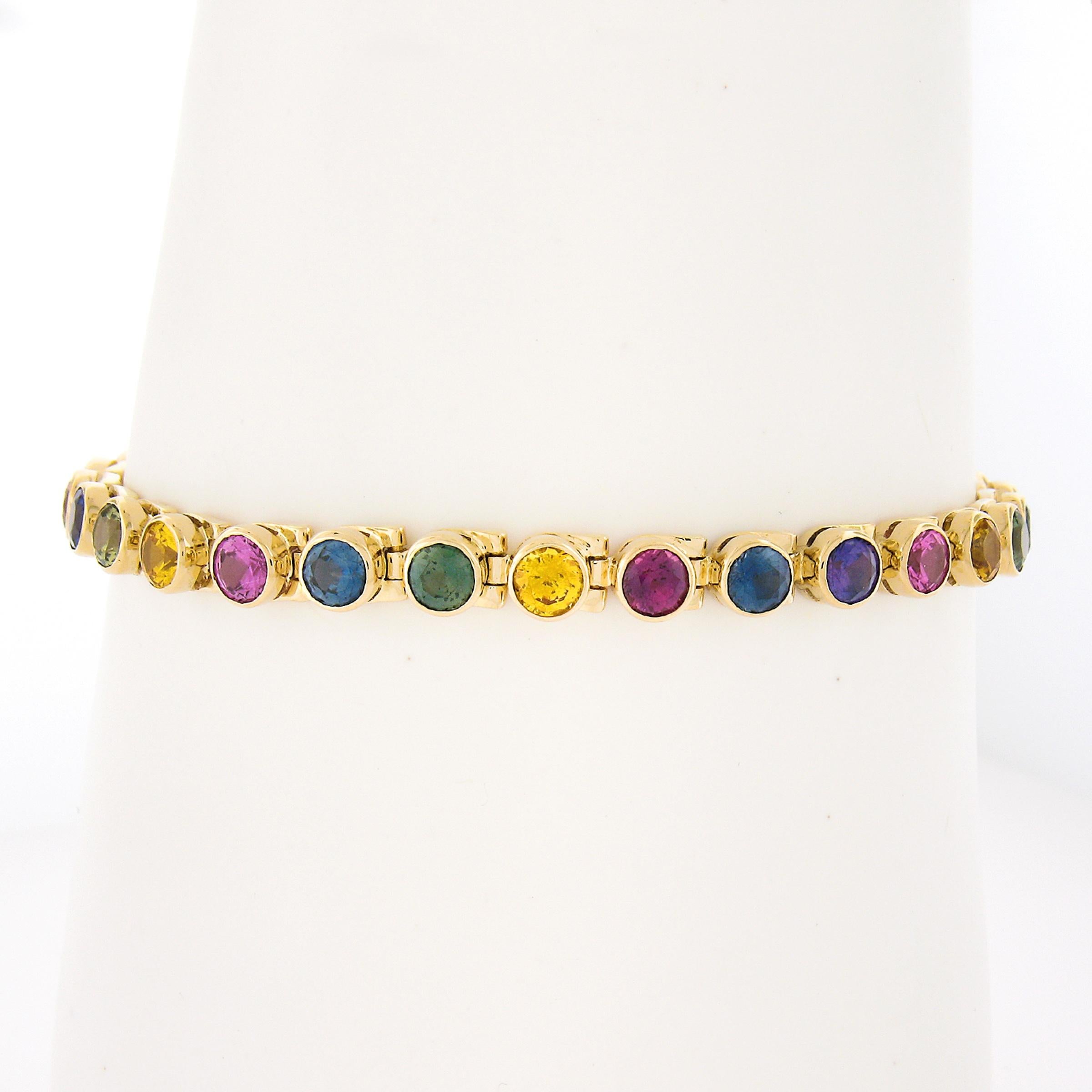 Here we have vivid colored sapphires in unusual round cuts all perfectly bezel set in luscious 18k solid yellow gold - must anything more be said? Enjoy!

--Stone(s):--
(29) Natural Genuine Sapphires - Round Brilliant Cut - Bezel Set - Vivid Vibrant