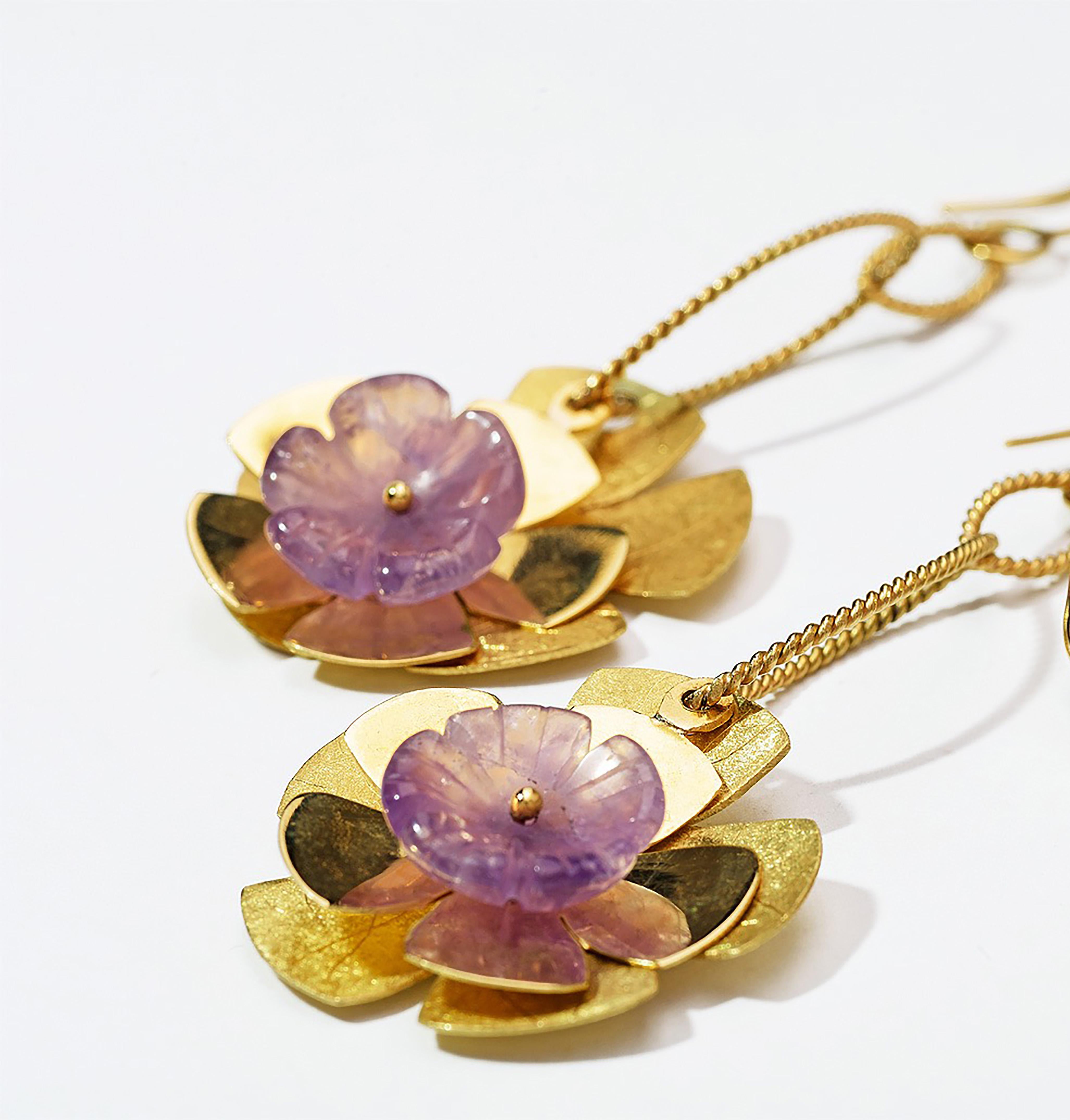 One-of-a-kind blooms for your ears. Movement and fluidity throughout, crafted in 18k yellow gold with a combination of polished, satin-finished flowers, and Amethyst cut flowers in the center. 

The Antu Earrings are part of the Constellation