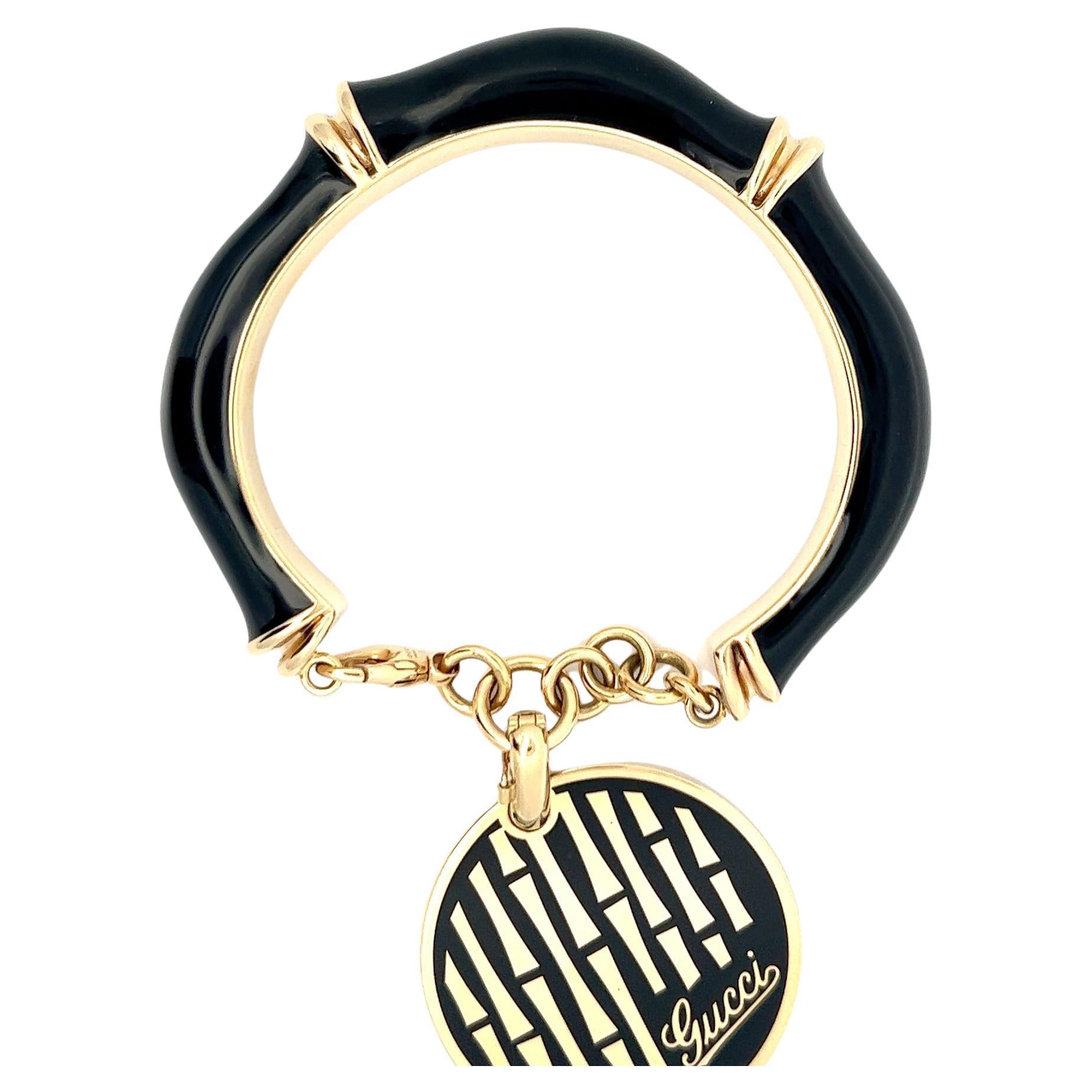 18k gold and black enamel bracelet by Gucci. For Sale