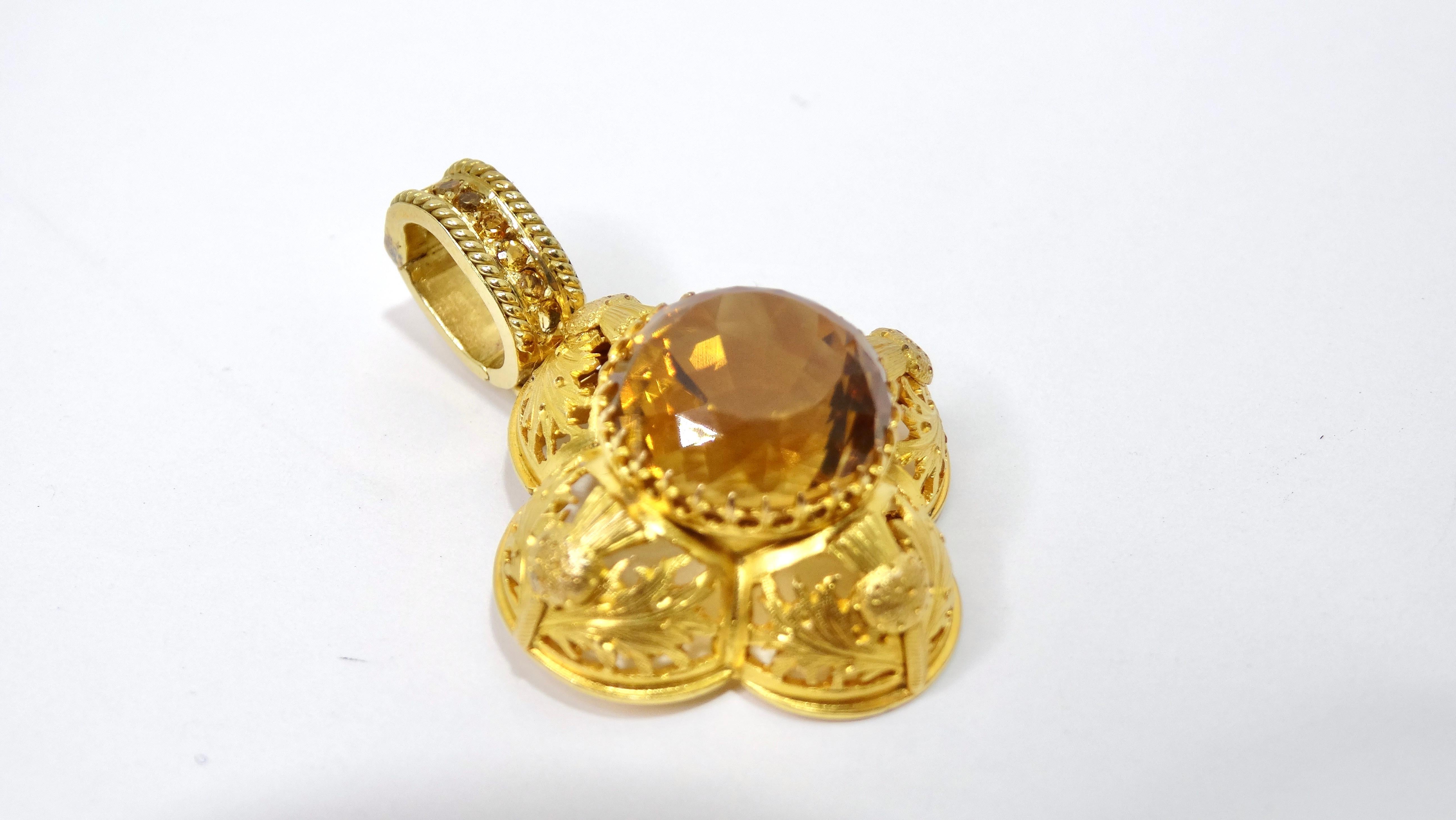 An exquisite and ornate pendant will be perfect to pair with your gold chain! This pendant is made of a beautiful and vibrant 18k gold with a large citrine stone in the middle of a shape resembling a flower. This vintage gem would look great with