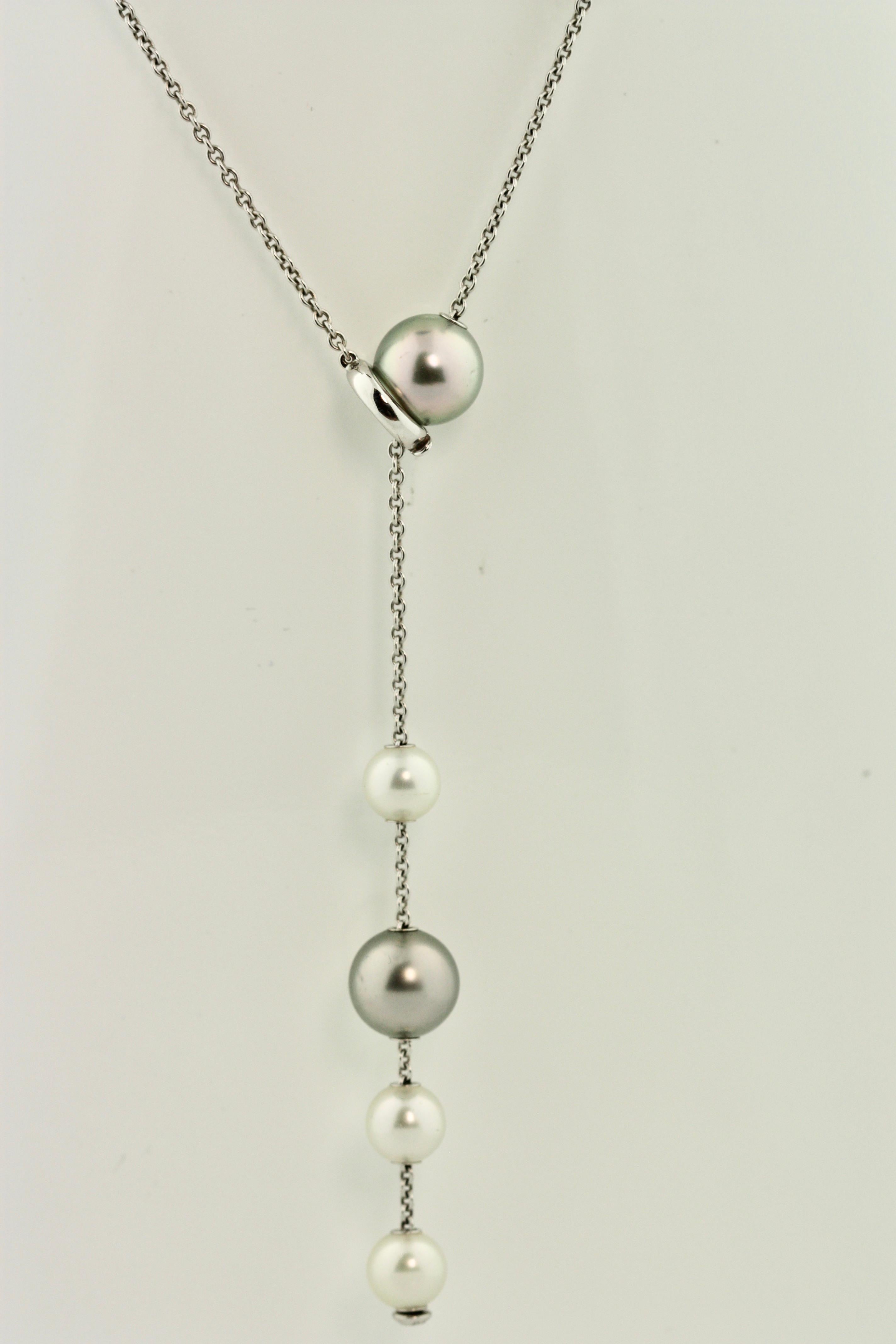 18K Gold and Cultured Pearl Necklace, Mikimoto 
8 pearls approx 9.8 to 7.5 mm, length 18 in. (45.72 cm.) 
maker's mark, box stamped Mikimoto accompanied by polishing cloth and booklet.
