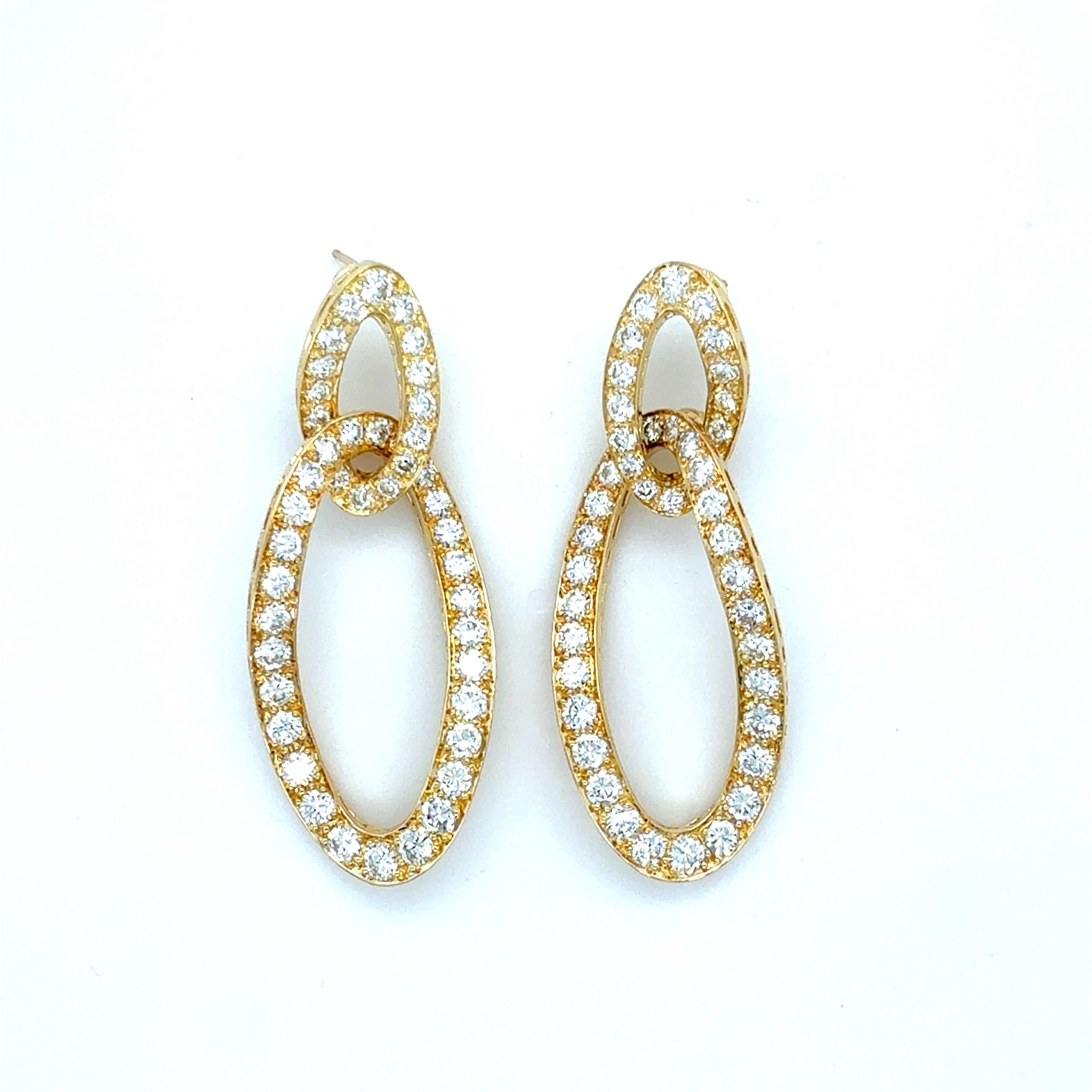 These gorgeous earrings feature 88 top quality round brilliant cut diamonds weighing approximately 7.50 carats total. Crafted out of 18 karat yellow gold in a stylish link design, with posts backings, these beautifully made earrings are just the