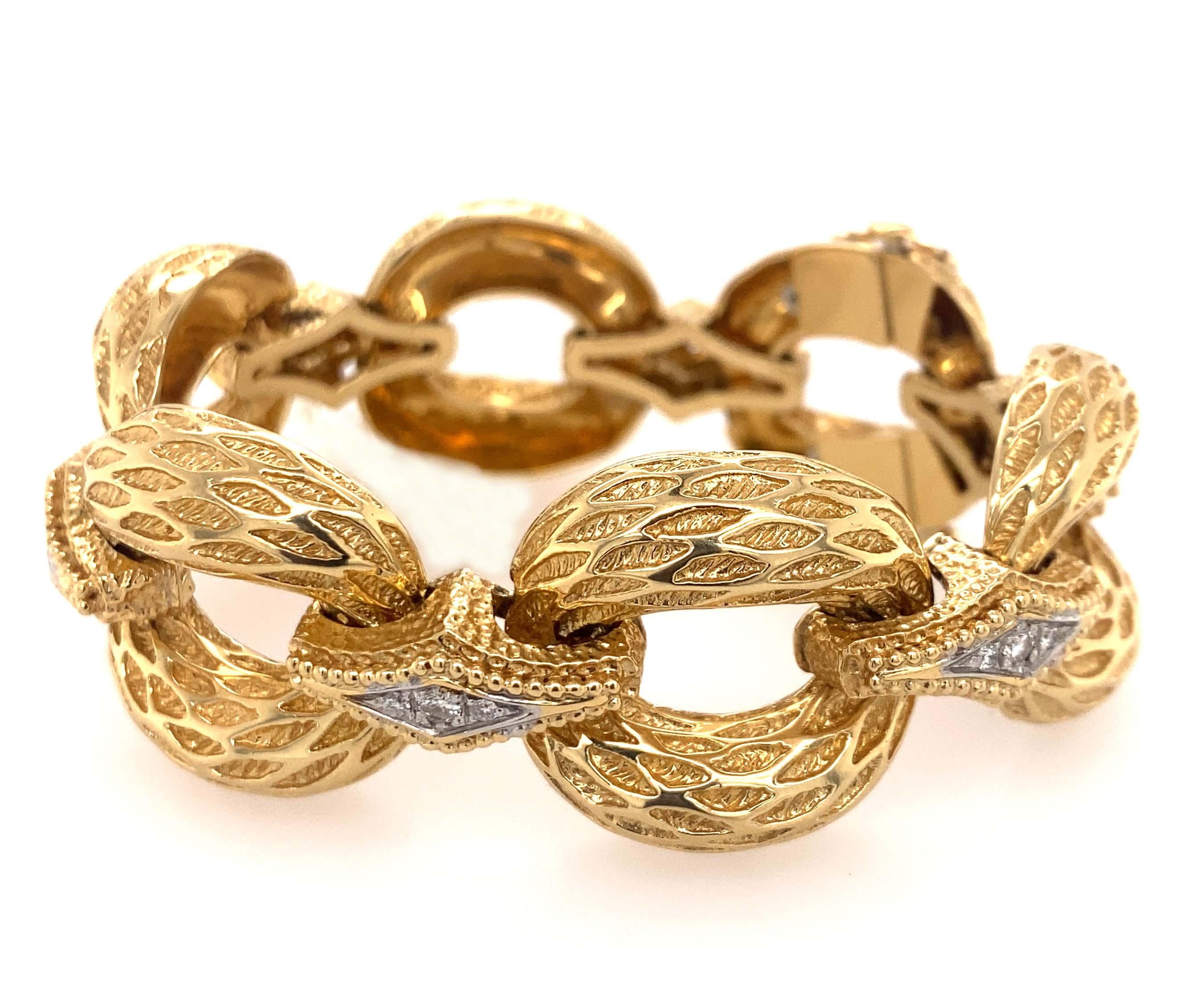 18k Gold and Diamond Link Bracelet .  Weight 66.6 dwt and measurement is  approximately 7 inches long x 1 inches wide. 