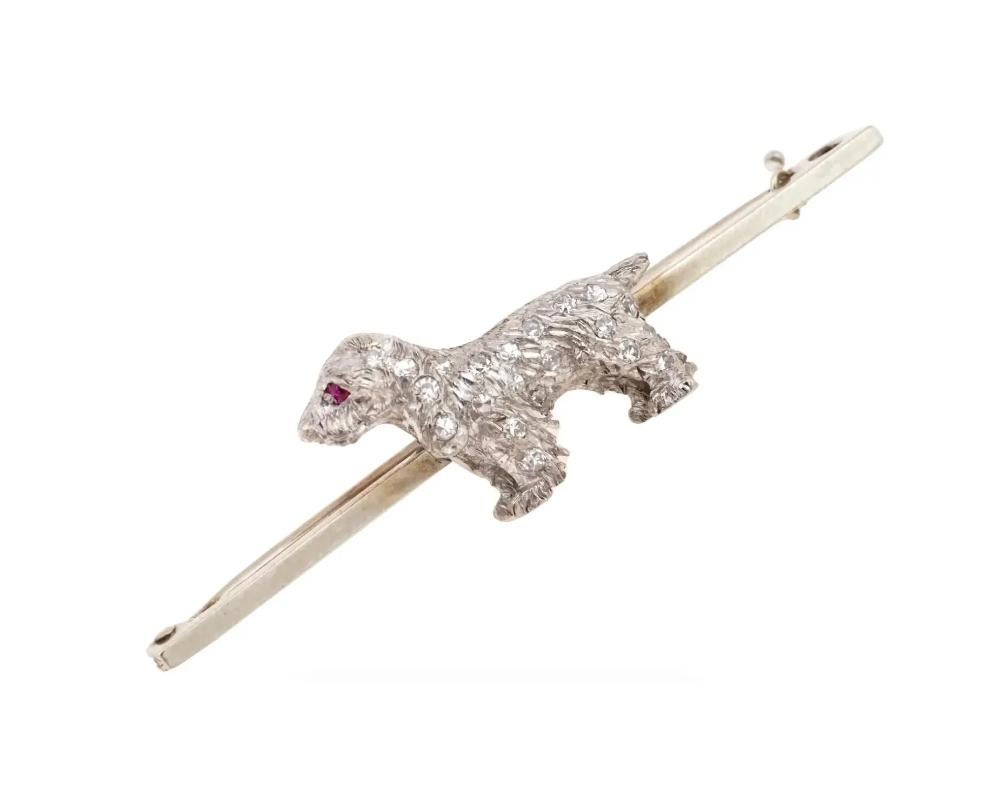 An 18K yellow gold pin brooch with a platinum dog figure garnished with diamonds. The eye of the animal is set with a cut ruby stone. Hallmarks 18Ct, 15Ct are on the pin. Total Weight: 5 grams. Elegant Luxury Lapel Jewelry And Accessories For