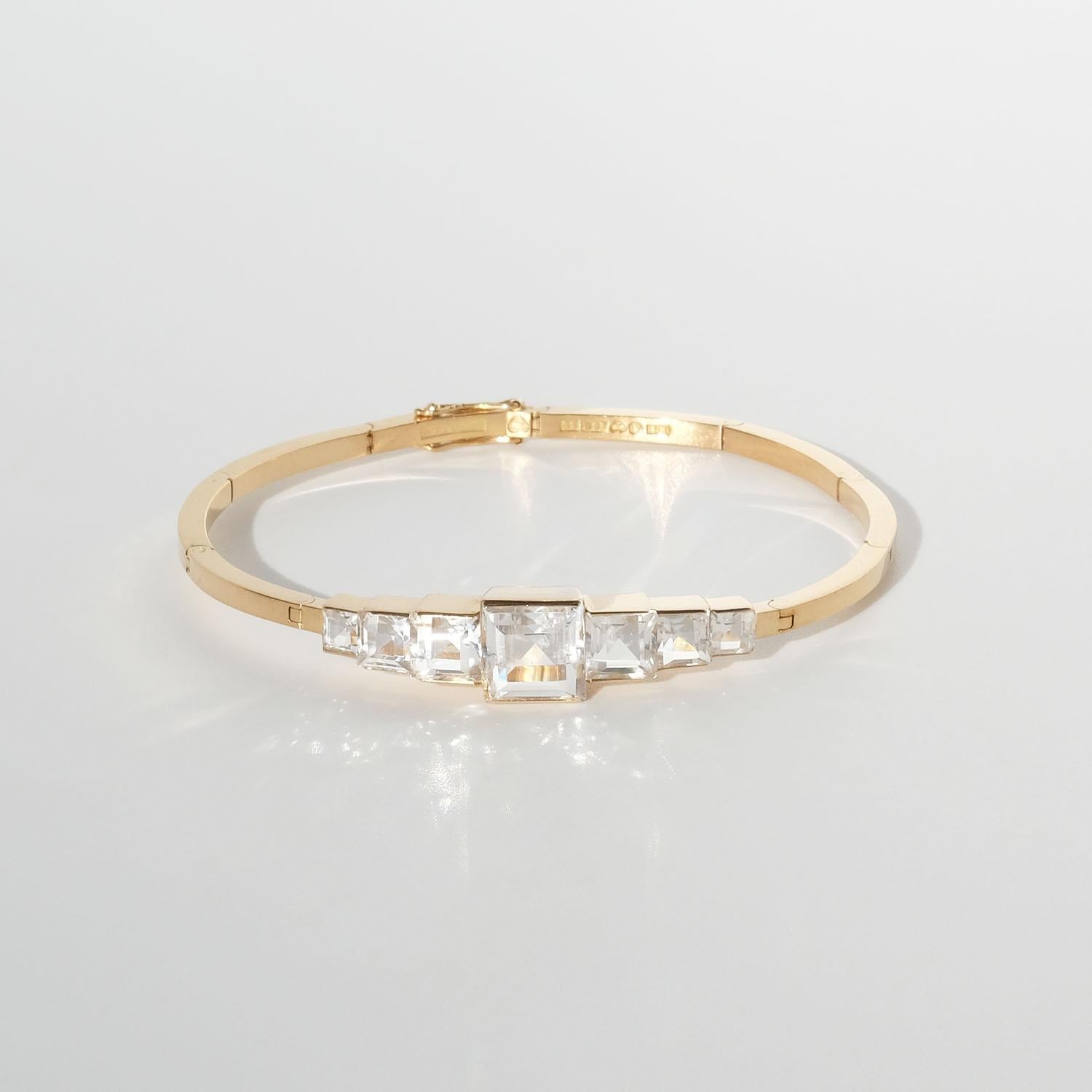 This exquisite Heribert Engelbert bracelet from 1944 is composed of 18 karat gold, featuring a sequence of arched links that provide a graceful structure to the piece. It is adorned with meticulously cut rock crystals , which are set in a clean,