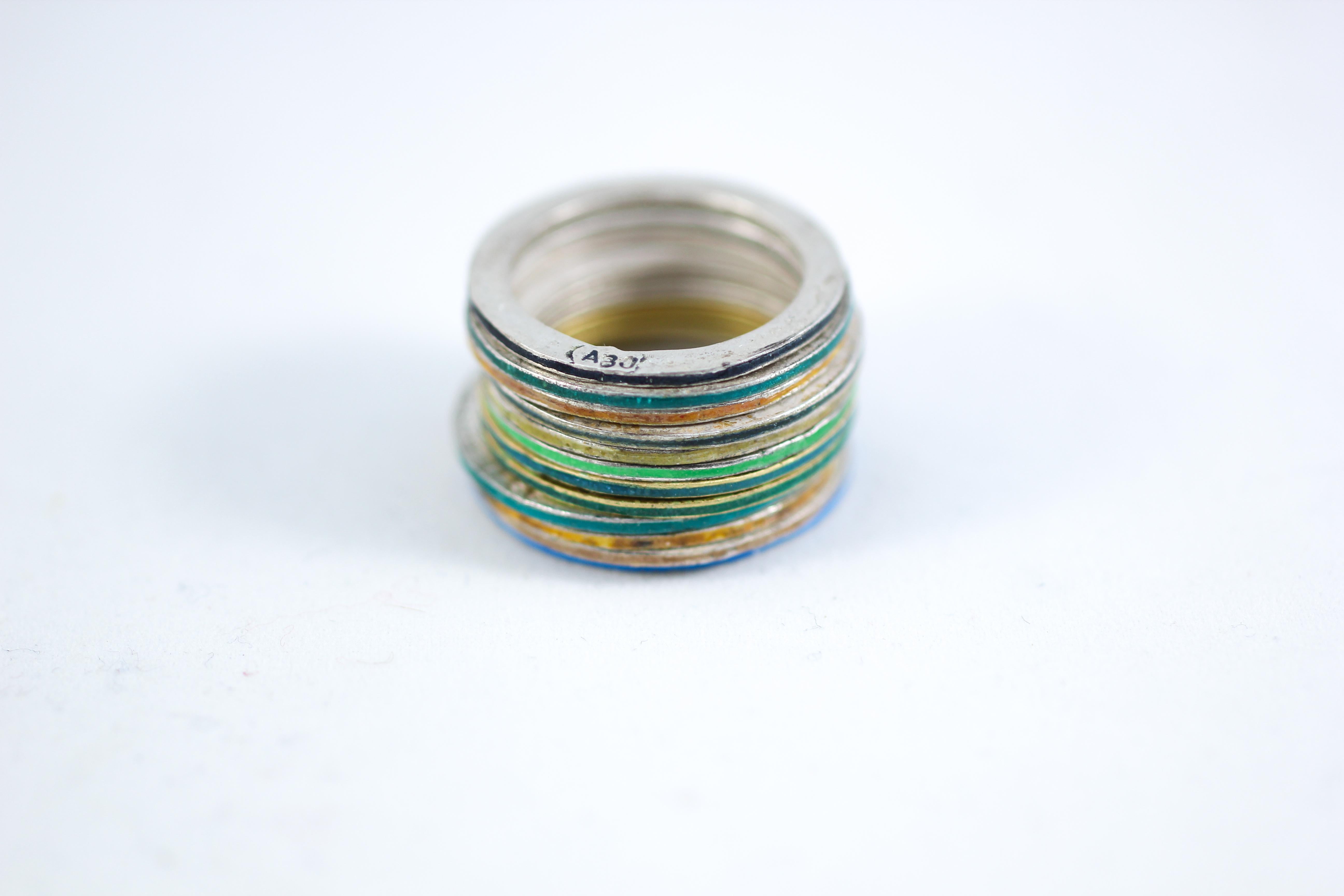 Simplicity Stack of 12 handmade gold and fine silver rings can be worn as an alternative bridal, anniversary, or unisex fashion band - 
This stack of rings combines two 18k gold and 10 fine silver rings all colored with enamels. Together they are