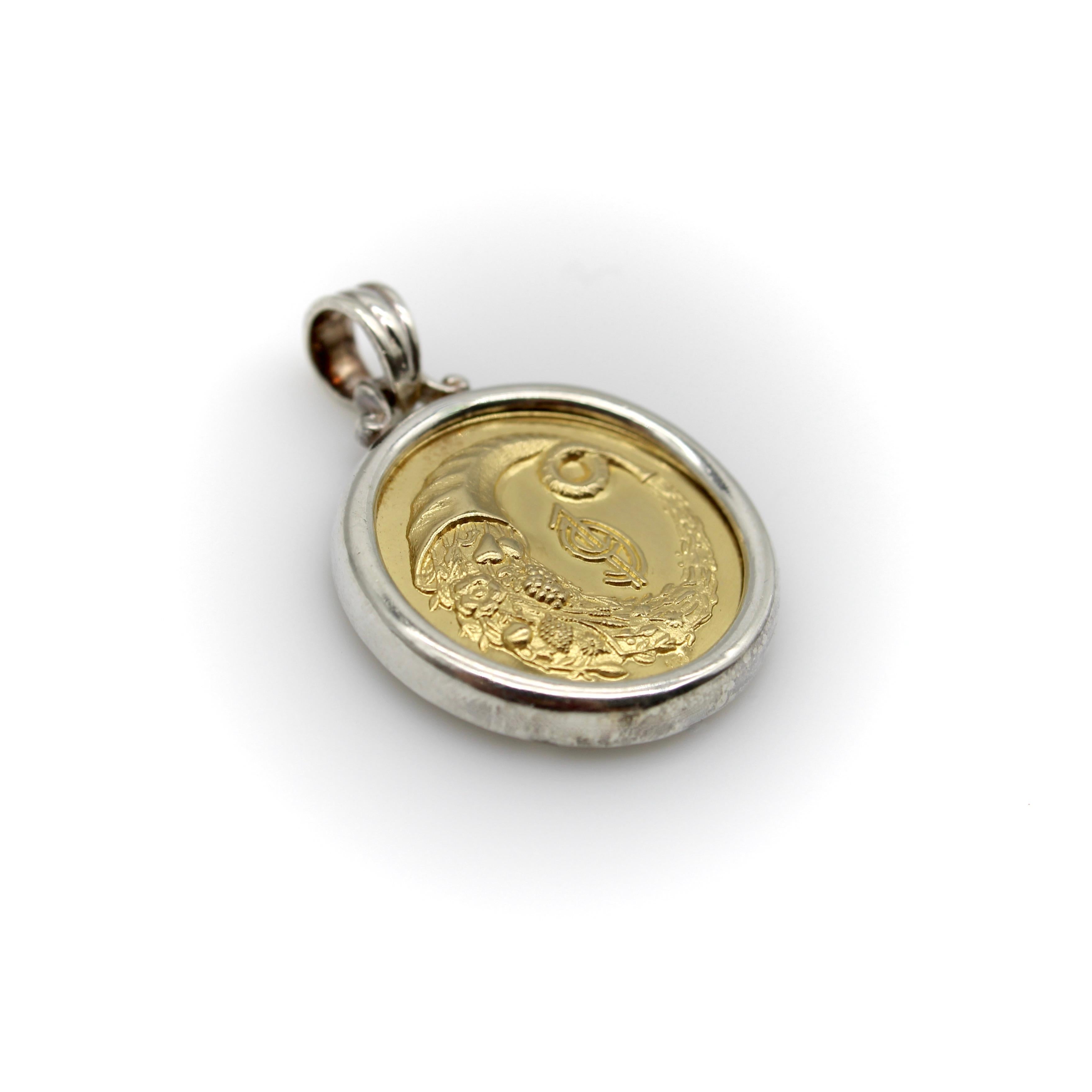 Each year, Greek jewelry designer Ilias Lalaounis introduces a good luck charm for the year ahead, often featuring classical Greek images associated with fortune and prosperity. This 18k gold medallion has the image of a cornucopia overflowing with