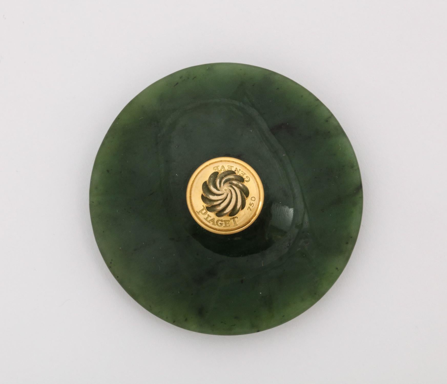 An 18-karat gold and Spinach Jade round box with cover by Piaget Geneve.

The fluted gold lid Marked 750 for 18K Gold and Piaget Geneve.

Very good condition. Ready to place.

Measures: 2.5
