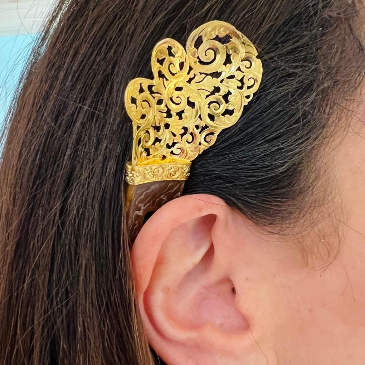 Everything old is new again! Hair accessories are the new way to make any look more fashionable. This antique hair pin is handcrafted with a spray of 18k gold scrollwork. The vintage piece measures 5 x 1 3/4in. Its unique beauty will turn heads!