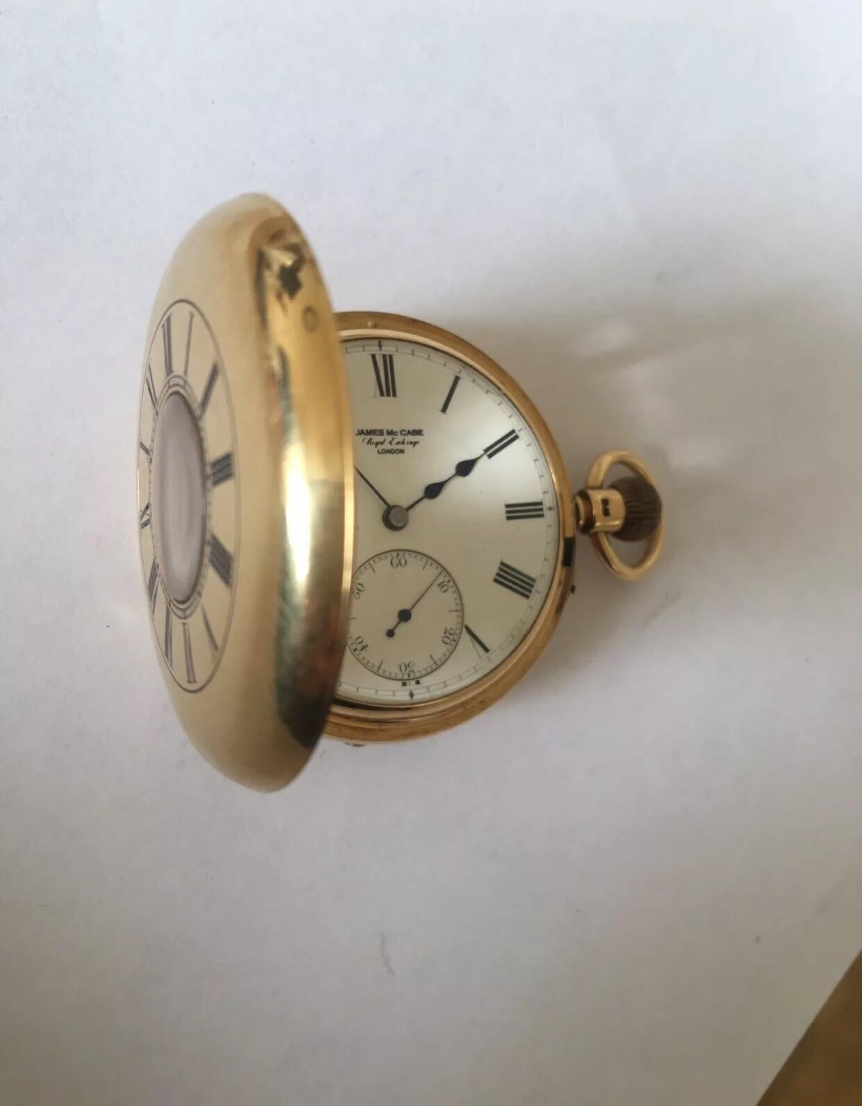 18K Gold Antique Half Hunter Pocket Watch Signed James McCabe, Royal Exchange London 

This 50mm diameter pocket watch is in good working condition and it is ticking well. Whilst this watch is old and antique we cannot guarantee the time accuracy.