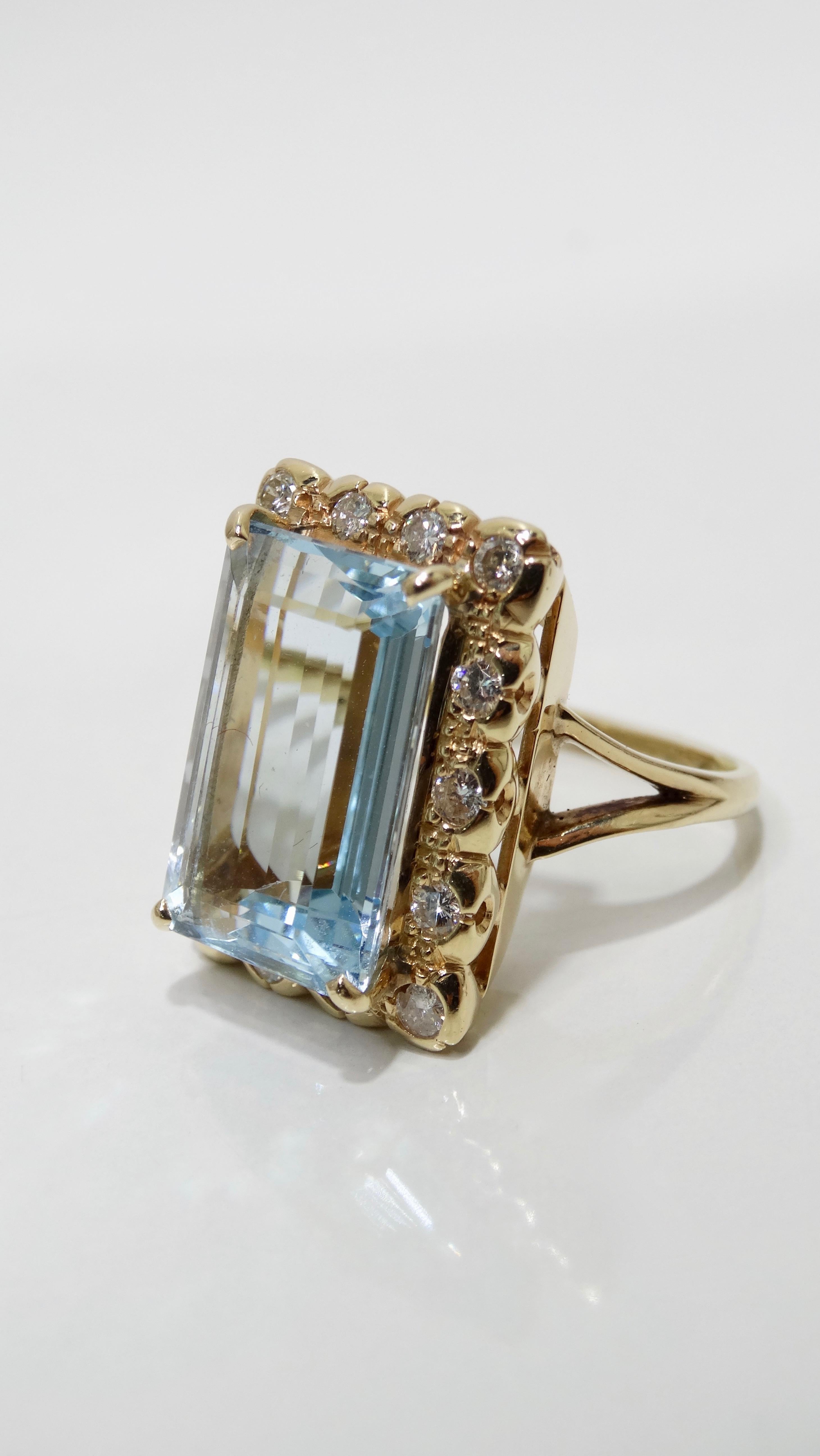 Elevate your evening looks with this stunning Aquamarine cocktail ring! Circa mid-20th century and set in a split style 18k Gold band, this Victorian style ring features an Aquamarine baguette cut center gemstone at approximately 12 carats with a