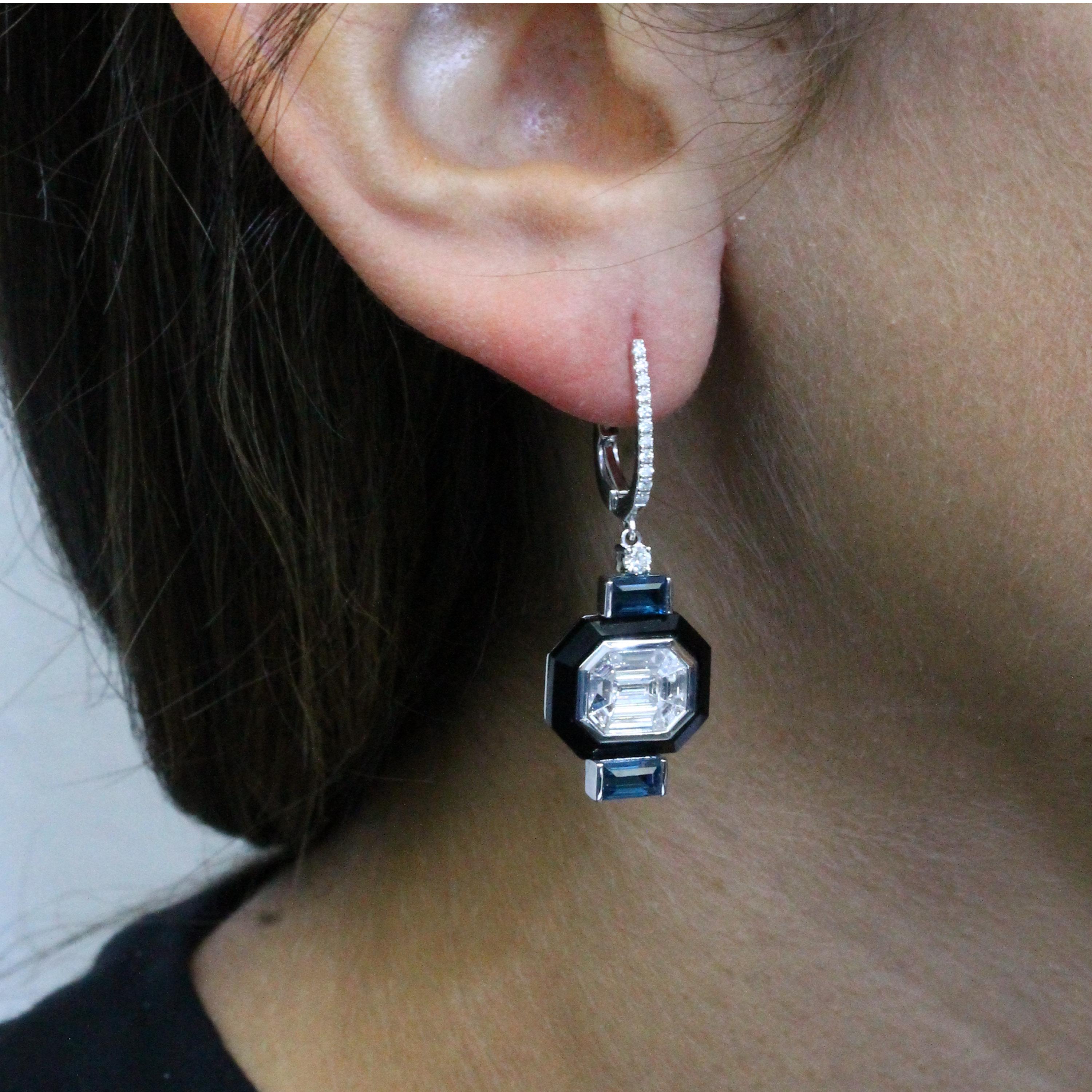 Mondrian collection Earrings featuring an Invisible-Set Emerald Diamond Centers made up of Baguettes, framed in Black Onyx, London Blue Topaz, in an 18K White Gold Art-Deco setting. Diamond Huggie Top Enclosures. The art works of Piet Mondrian