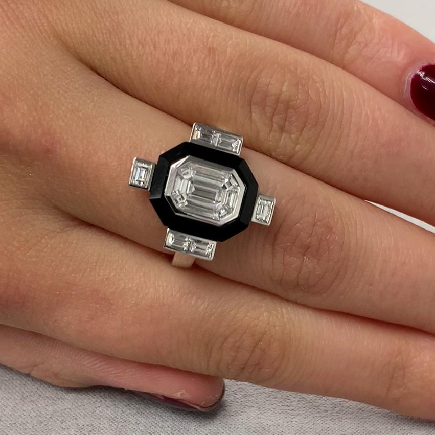 Mondrian Ring featuring an Invisible-Set Emerald Diamond Center made up of Baguettes, framed in Black Onyx, in an 18K White Gold Art-Deco setting. Finger size 6.5, adjustable upon request/quote. The art works of Piet Mondrian inspire the look of the