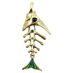 Ciondolo scheletro a lisca di pesce articolato in oro 18K con smalto di UnoAErre