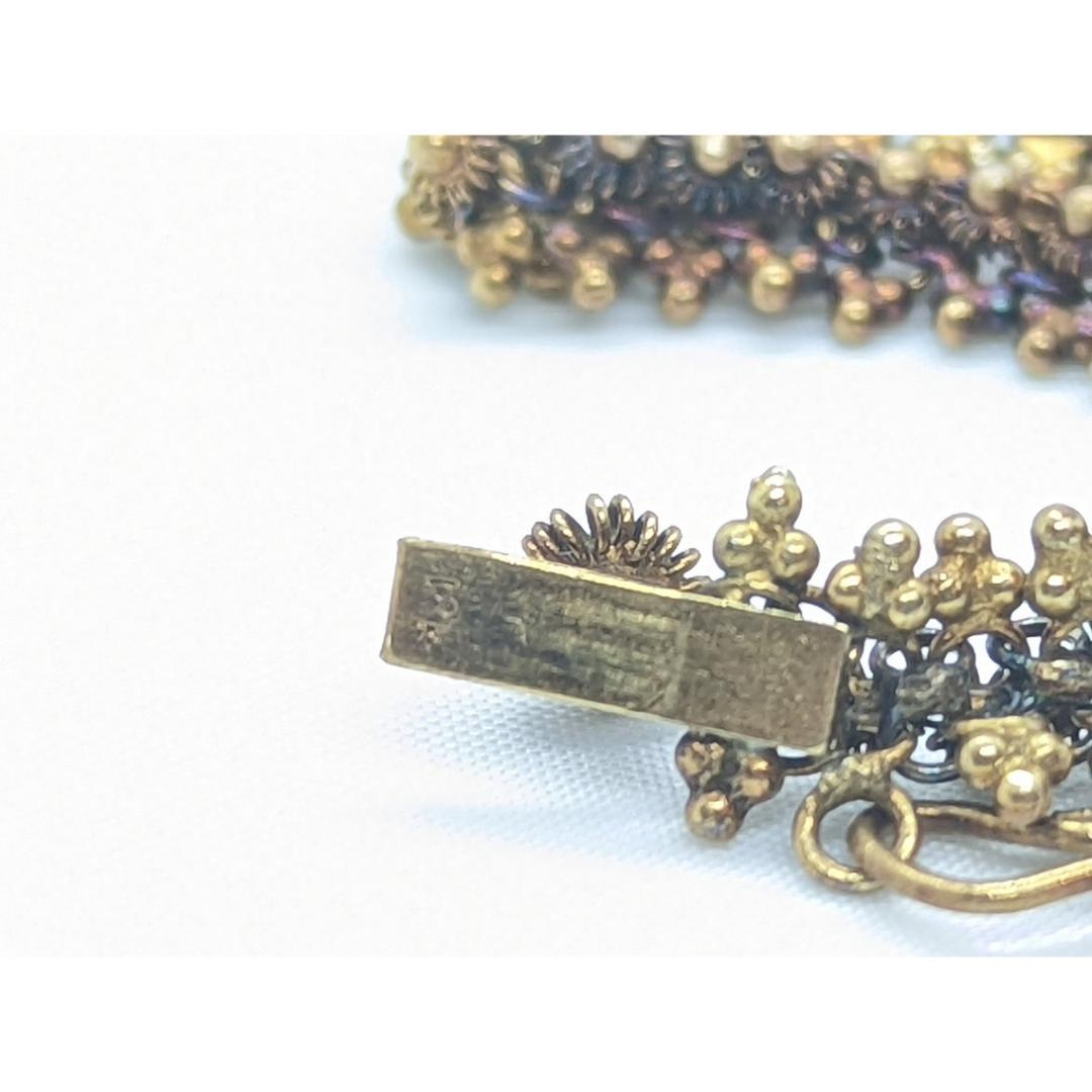 Vintage from the 1980s
Materials: Gold

Jewelry type: Bracelet, Ring

Stunning 18k Dark Gold with Bluing effect. Bead mesh motif. Made to impress.

Condition: Shows some signs of wear. Vintage

Details:
18k Gold marked
19.9 grams total weight
13mm