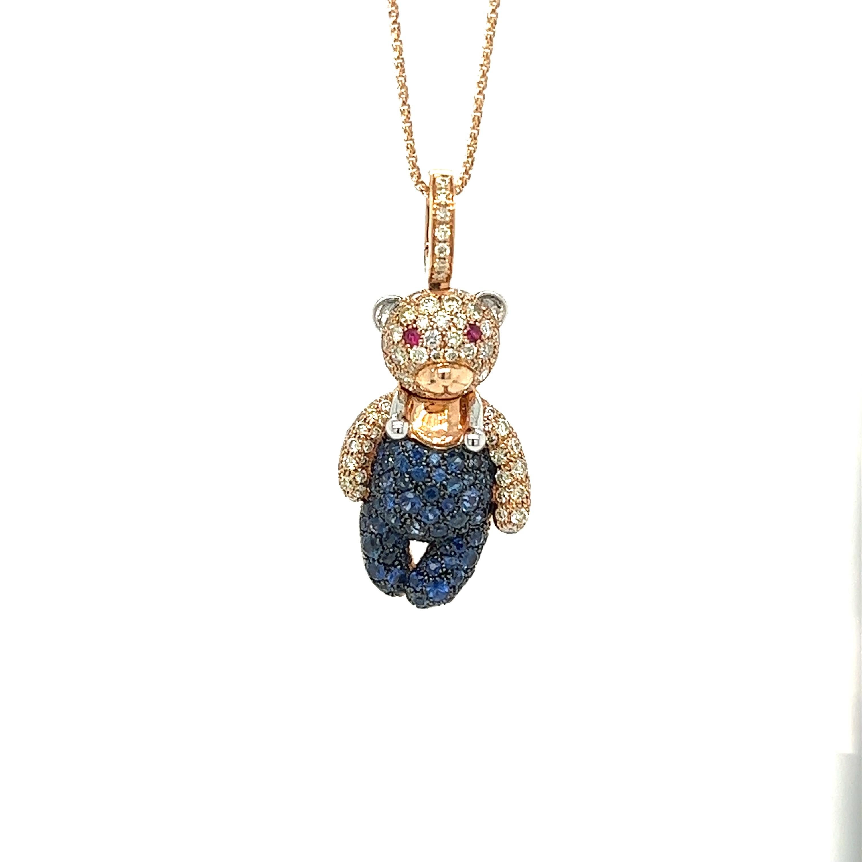 18K Gold Bear Necklace with Fancy Diamonds & Blue Sapphires

72 Blue Sapphires 1.24 CT
82 Fancy Diamonds 0.90 CT
2 Rubies 0.04 CT
18K Rose Gold  7.51 GM

This stunning necklace features a charming bear pendant adorned with beautiful Blue Sapphires,