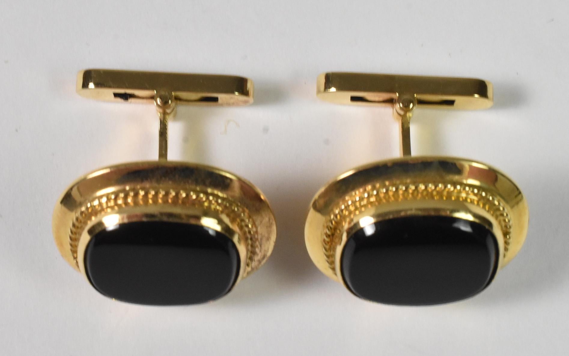 18k yellow gold cufflinks with black onyx center stones. Beautiful form, 18K spring clip high polished onyx. Excellent condition, like new. 13 grams. Onyx stone is 1/2