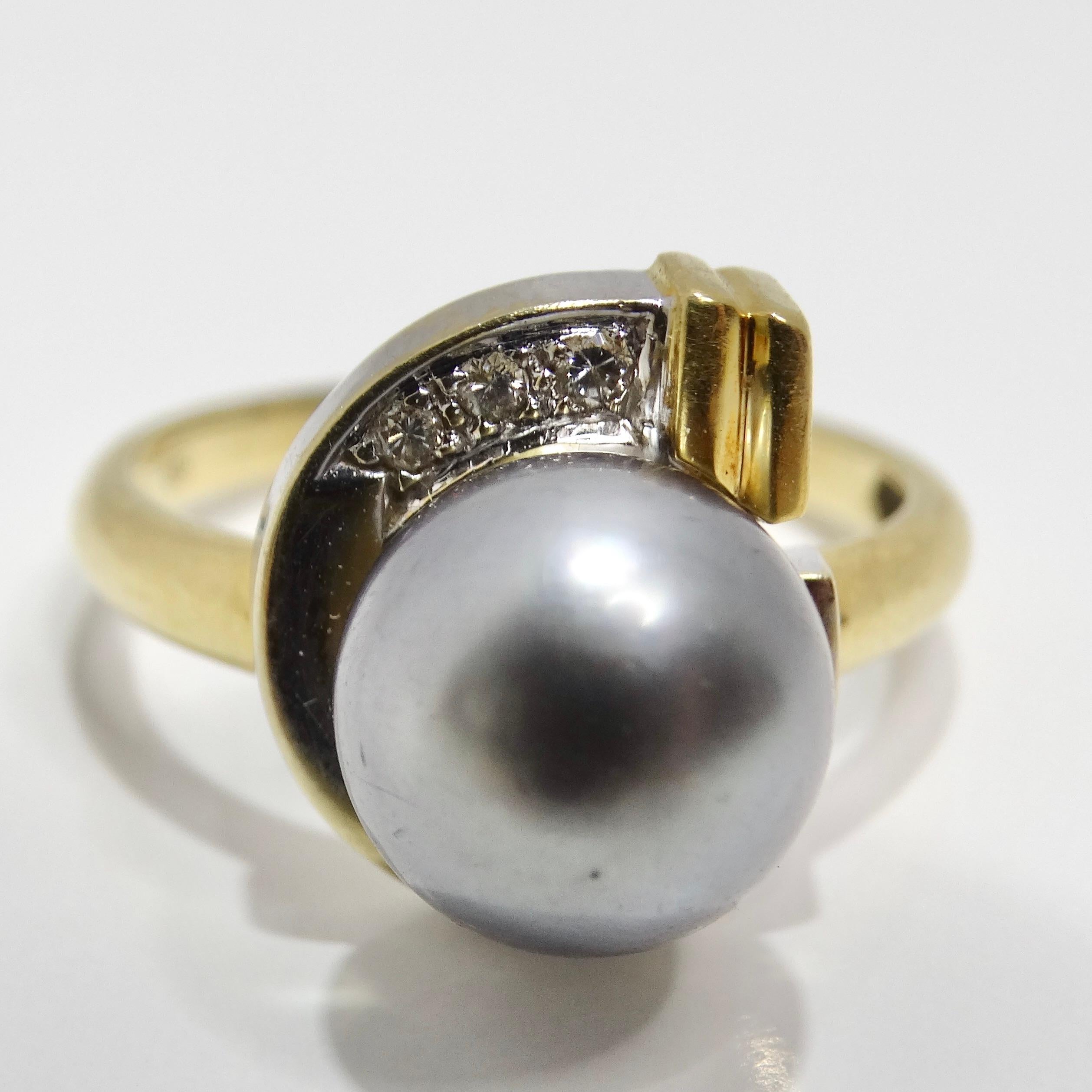 Introducing the extraordinary 18K Gold Black South Sea Pearl Diamond Ring, a truly unique and special piece that embodies elegance and sophistication. Crafted in 1970, this ring features a stunning black South Sea pearl set in two-tone yellow and