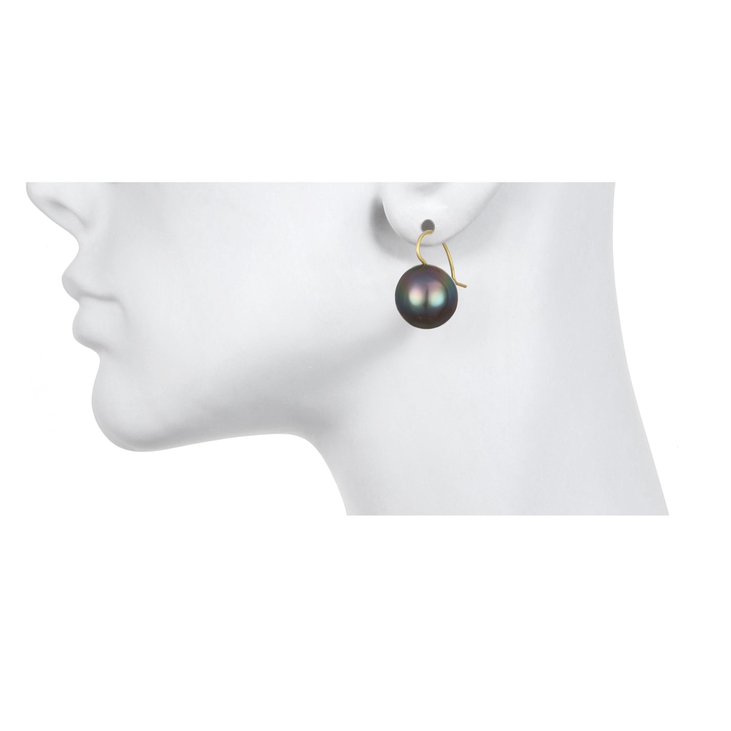 Faye Kim's pearl earrings are classic, timeless, and simply chic - the natural beauty of Baroque Black Tahitian cultured pearls are highlighted simply with 18k gold ear wires.  
Each pearl is unique and varies slightly in shape and color due to its