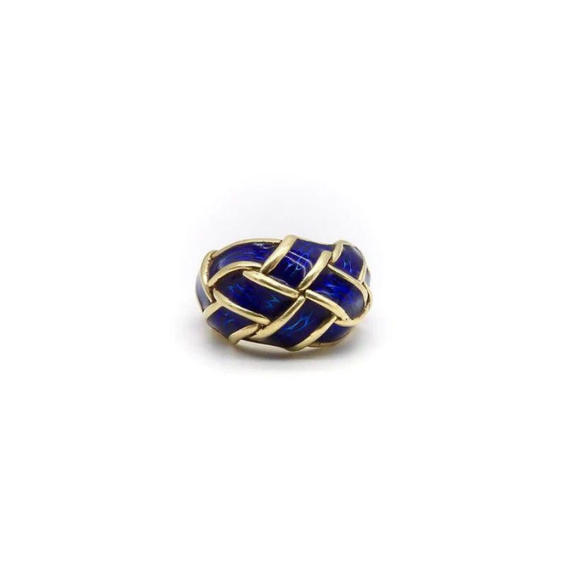 This vintage Hidalgo ring weaves together 18k gold and gorgeous cobalt blue enamel for a bold and striking look. The guilloche enamel is transparent, which allows for the texture of the gold underneath it to shine through with a visual effect that