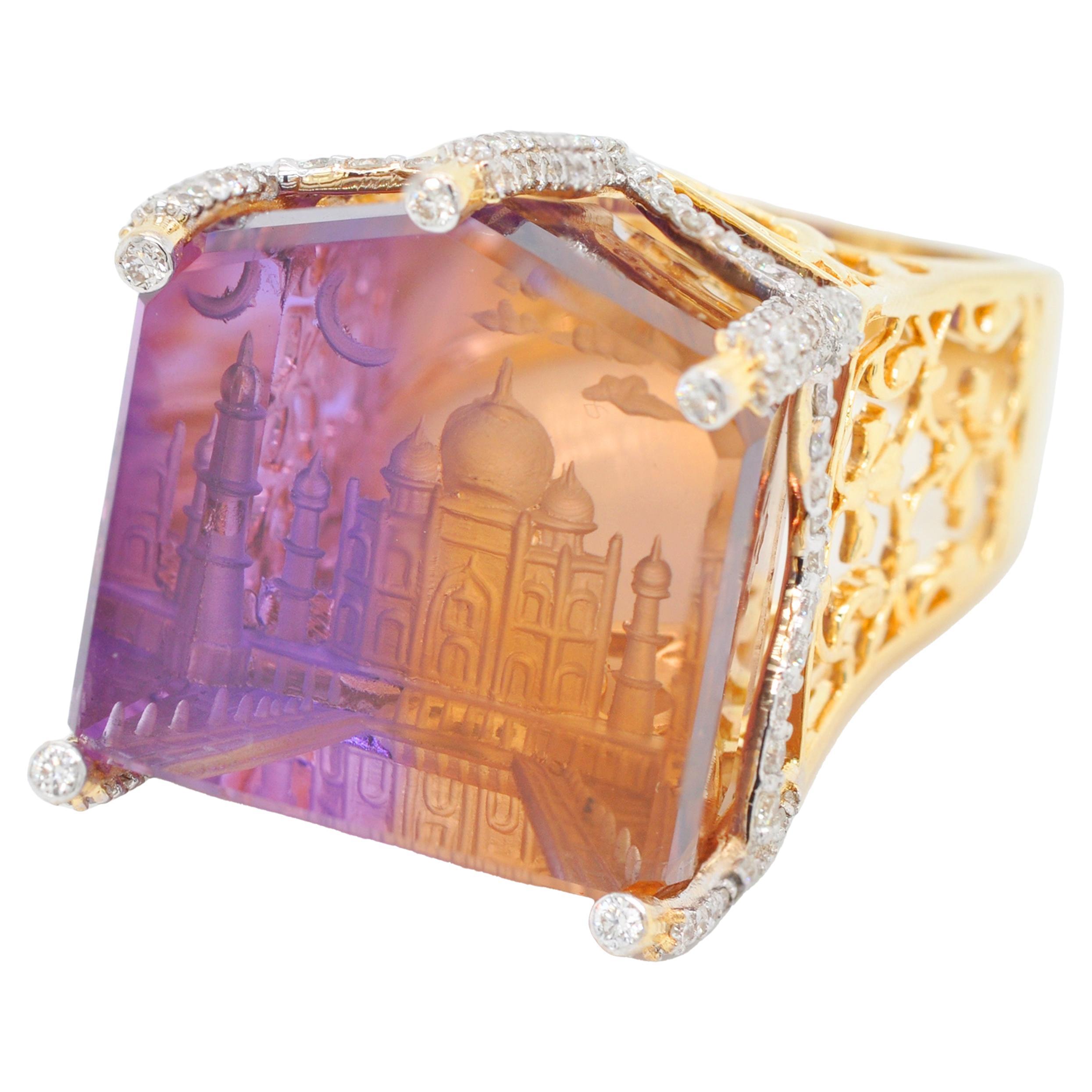 18 karat gold bolivian ametrine taj mahal intaglio undercarving diamond unique cocktail ring

Introducing the one-of-a-kind Ametrine Taj Mahal Ring, a masterpiece of artistry and craftsmanship. Set in 18K gold and adorned with diamonds, this ring