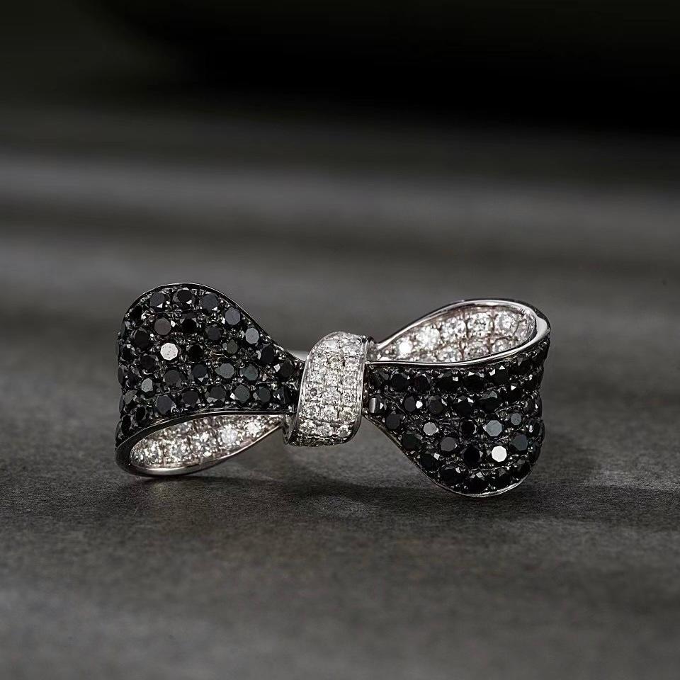 Modern 18K Gold Bow-Shaped Black Diamond & Diamond Ring For Sale