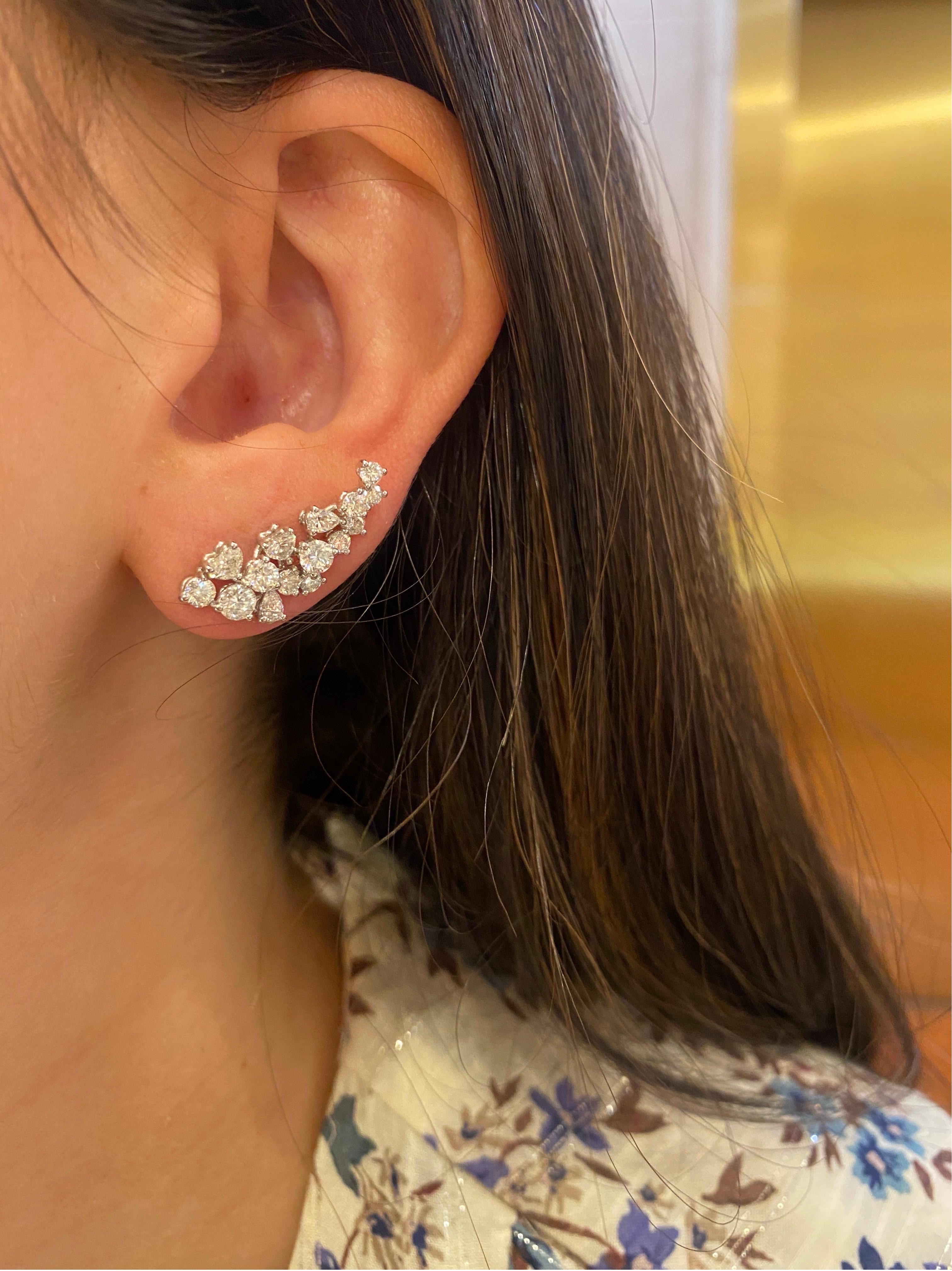 Earrings of rich elegance and timeless spirit. These dazzling climber diamond earrings are handcrafted with the utmost love and attention to detail. Inlaid with intricate diamonds and cut into brilliant heart, pear and round shapes.

Composition: 30
