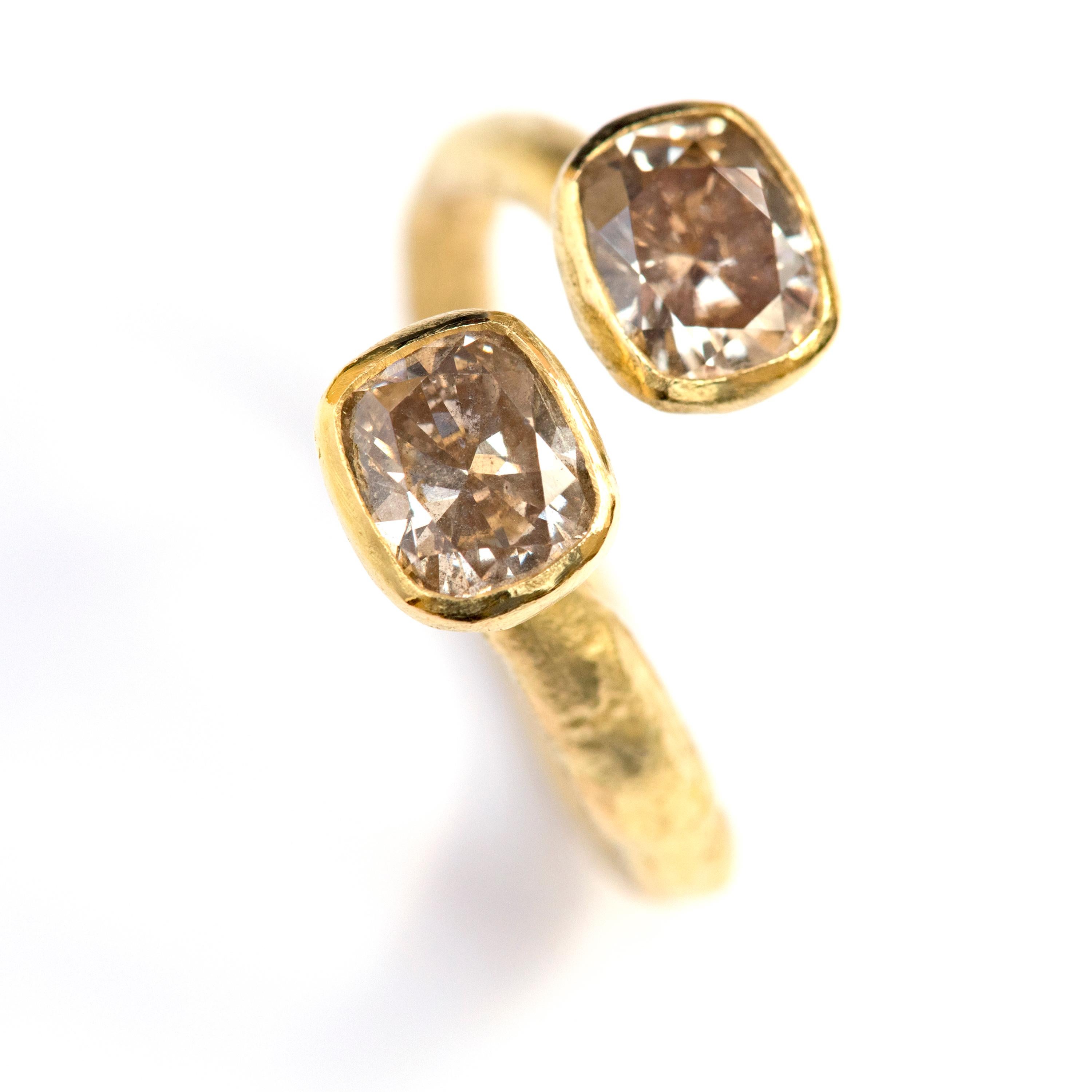 18k Gold textured open ring with two cushion cut Brown Diamonds, one carat each. This ring has been handmade by renowned Goldsmith Disa Allsopp using reticulation techniques. The 1ct warm brown diamonds are set in tapered 18k yellow gold rubover