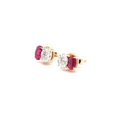 18k Gold Burmese Oval Ruby Cts 1.00 with Marquise and Princess‑Cut Diamond