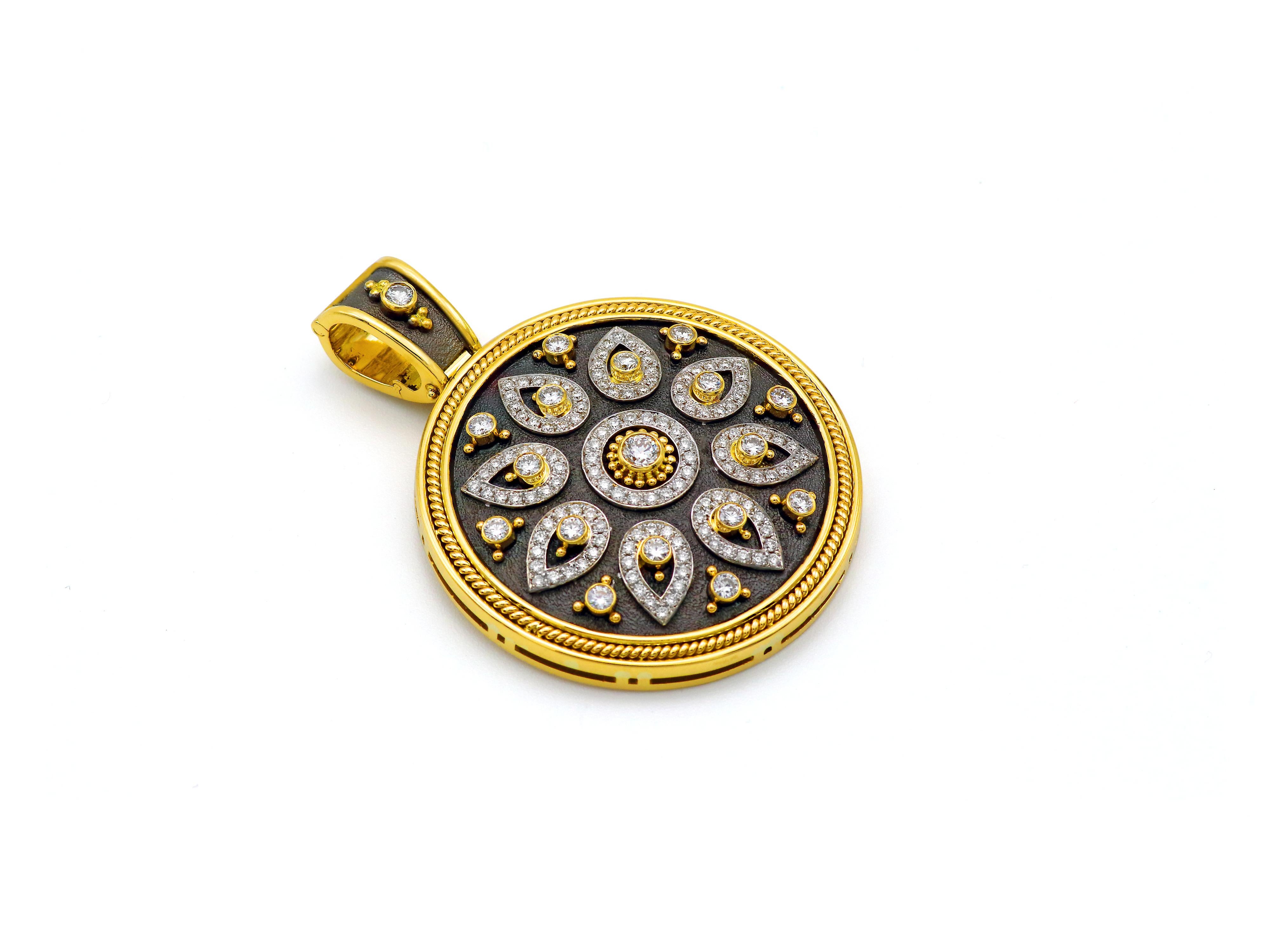 18 karats white and yellow gold pendant of the Noir collection in a dramatic size and impeccable workmanship, set with 1.72 carats selected extra white diamonds and our heavy 18k gold work. Our exclusive opening bezel allows you to have a million