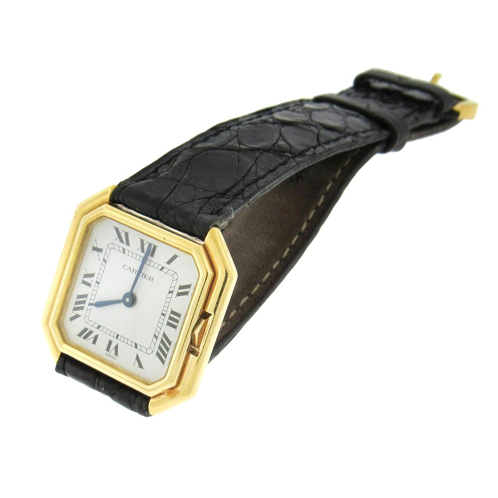 18K yellow gold Cartier Paris Ceinture model, made in the 1990’s is a fine, octagonal, 18K yellow gold wristwatch. The case measures 27mm x 27mm and has a stepped bezel, inset winding crown, four screws between the lugs.The dial is off-white with