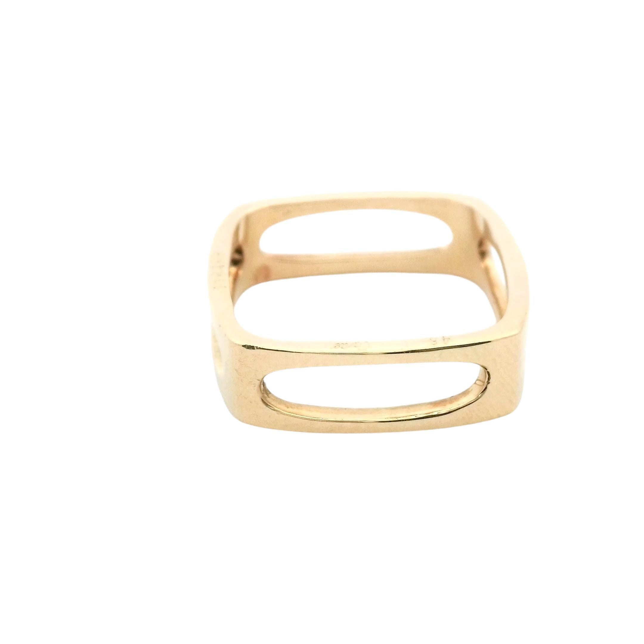 A study in form and elegance.

This striking Cartier ring showcases a unique open square design, crafted in luxurious 18k yellow gold. The minimalist structure highlights the beauty of the metal, creating a bold statement piece.

A distinctive