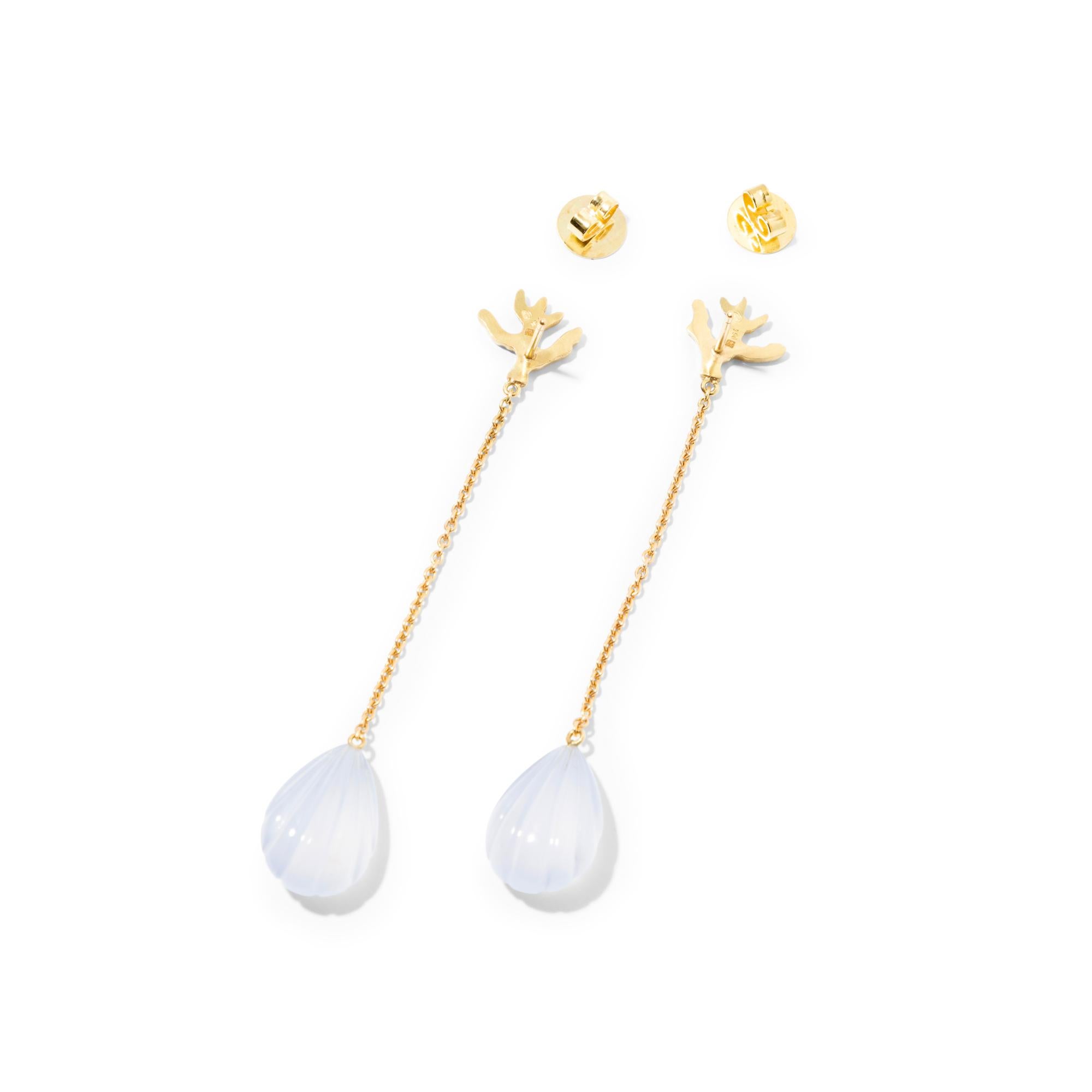 A feminine and elegant pair of 18k gold chain earrings with carved pale blue chalcedony shells, suspended from a gold coral motif that neatly covers the earlobe.  A great everyday piece of jewelry when only a hint of color is needed. Playful and