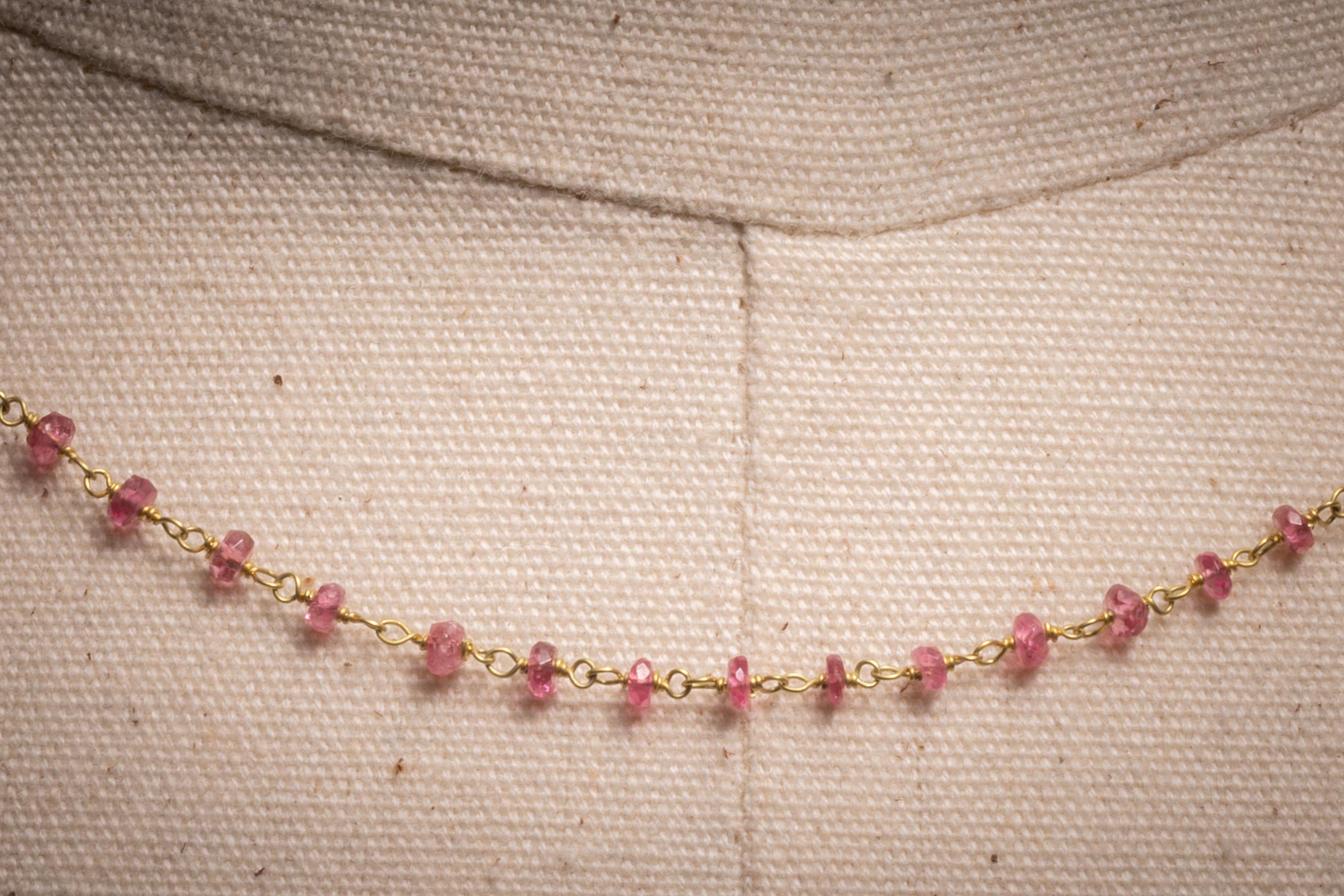 A simple and lovely 18K gold hand-wired link necklace with faceted Burmese ruby beads.  Rubies from this area tend to be more pink than that your traditional red ruby. S-hook clasp in 18K.

The fine jewelry collection is sourced, designed or created