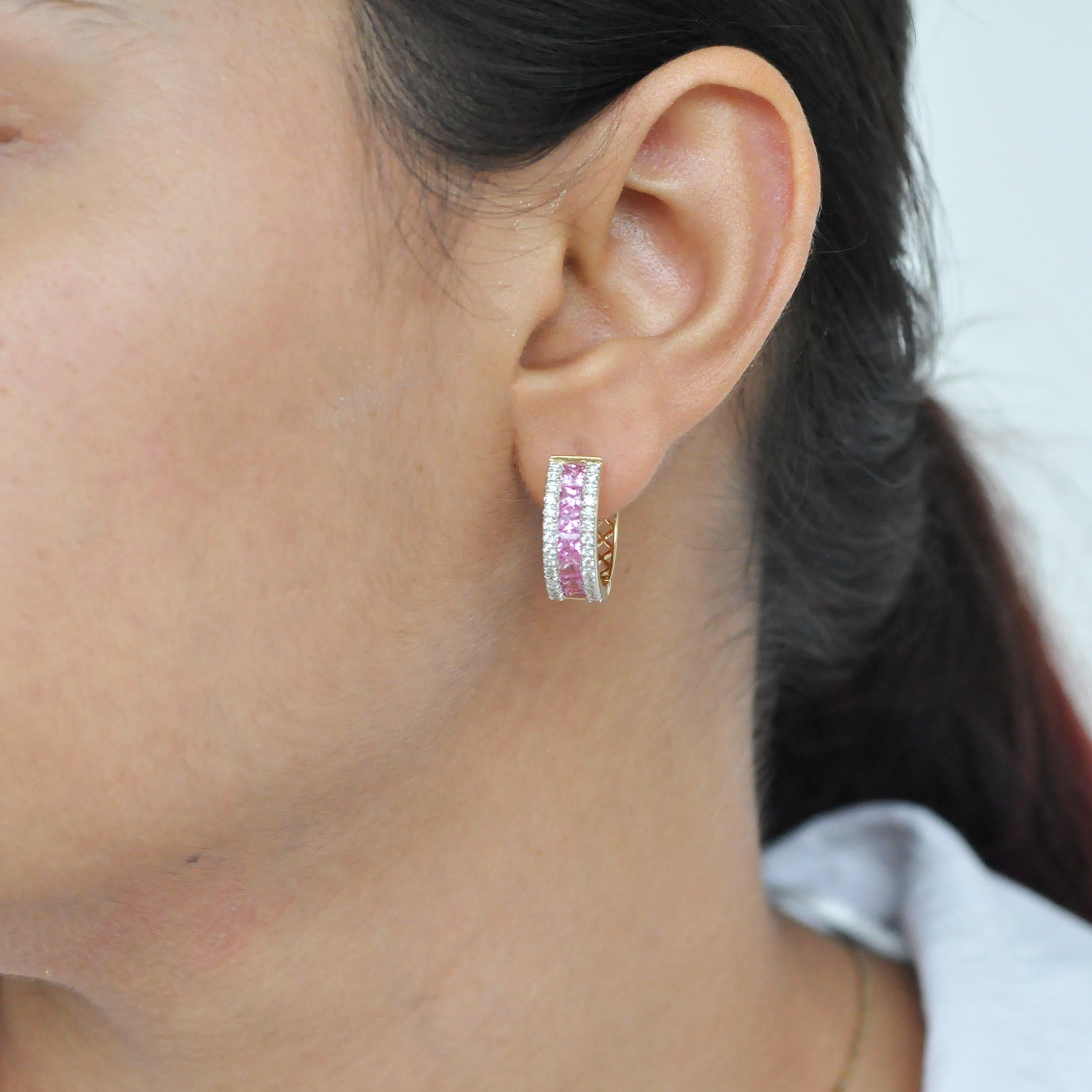 18 karat gold channel set princess cut pink sapphire diamond huggie hoop earrings.

The enchanting mini-hoop earrings with the vibrant pink sapphires incorporated within an equivalent layer of micro pave set diamonds on either side is distinctive in