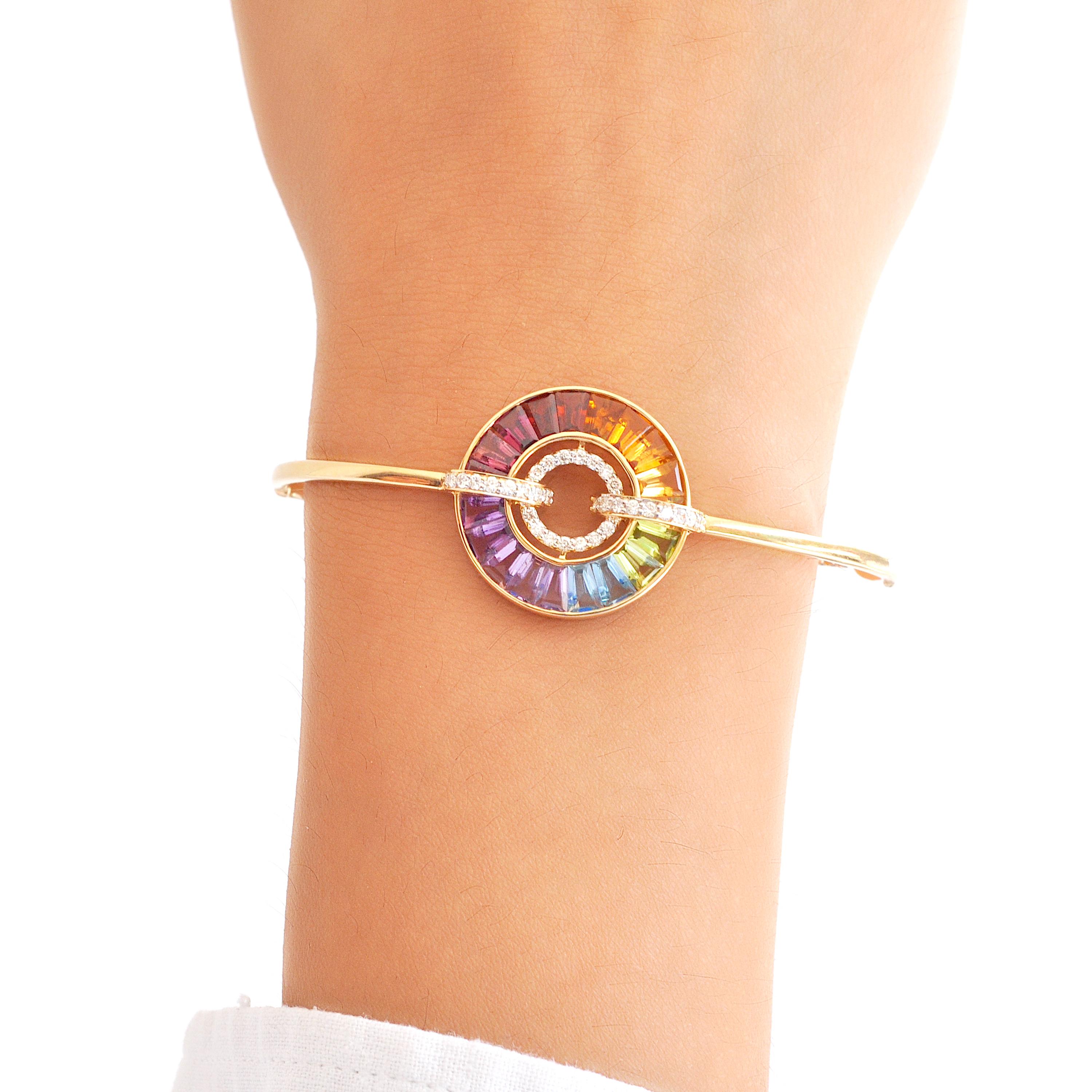 18 karat gold channel set rainbow baguette gemstones diamond circle bolo bracelet

This bracelet is a radiant celebration of color and elegance. Crafted with meticulous precision, this bracelet features a stunning arrangement of vibrant rainbow