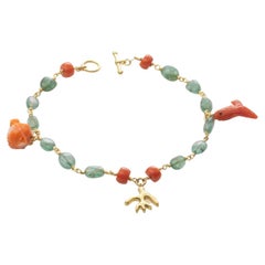 18k Gold Charm Bracelet with Coral Fish and Emerald Beads