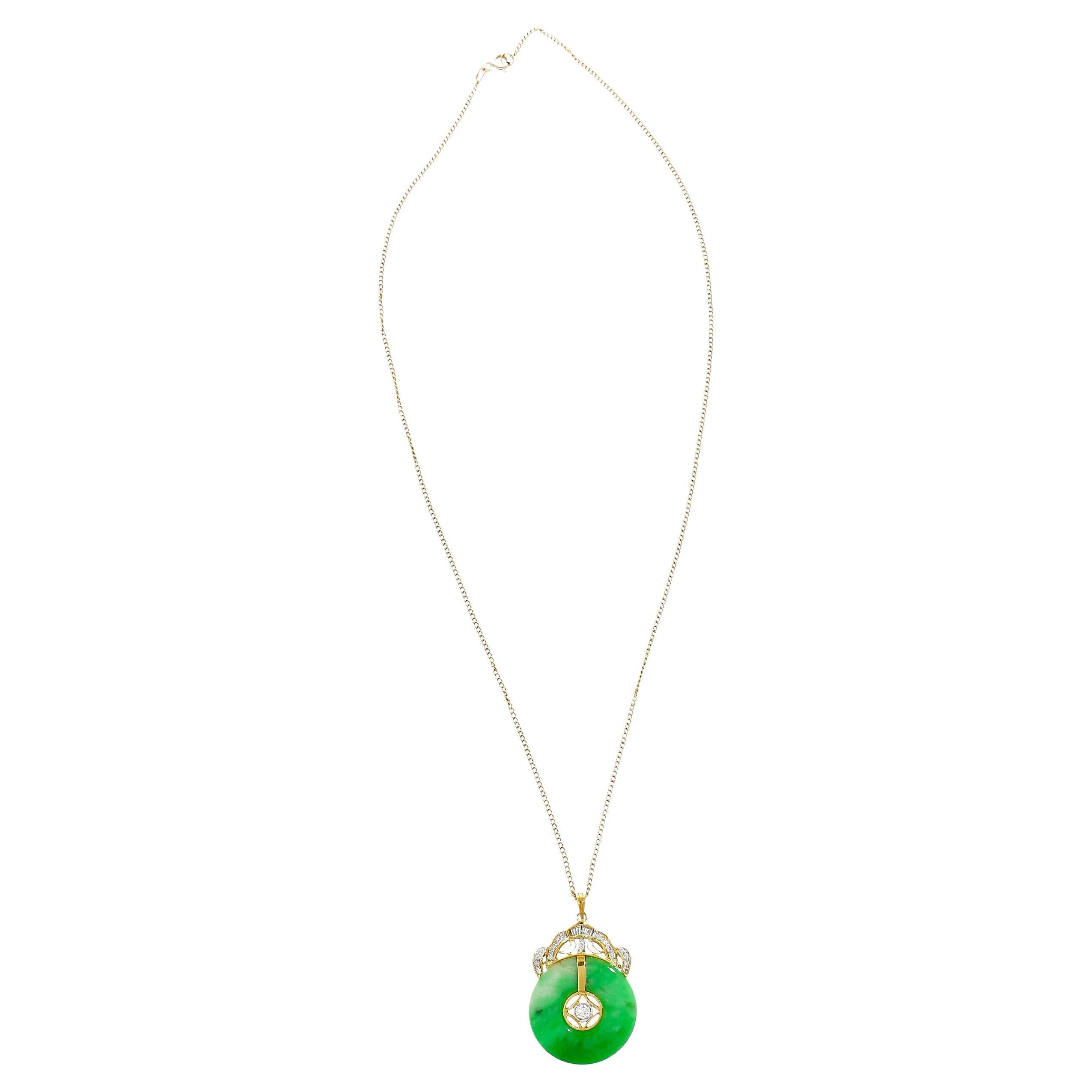 18K Yellow Gold Necklace adorned with a mesmerizing circular green Jadeite Jade pendant. Embellished with a shimmering set of white baguette and round cut diamonds. The gems are securely set, ensuring both their stunning beauty and longevity. The