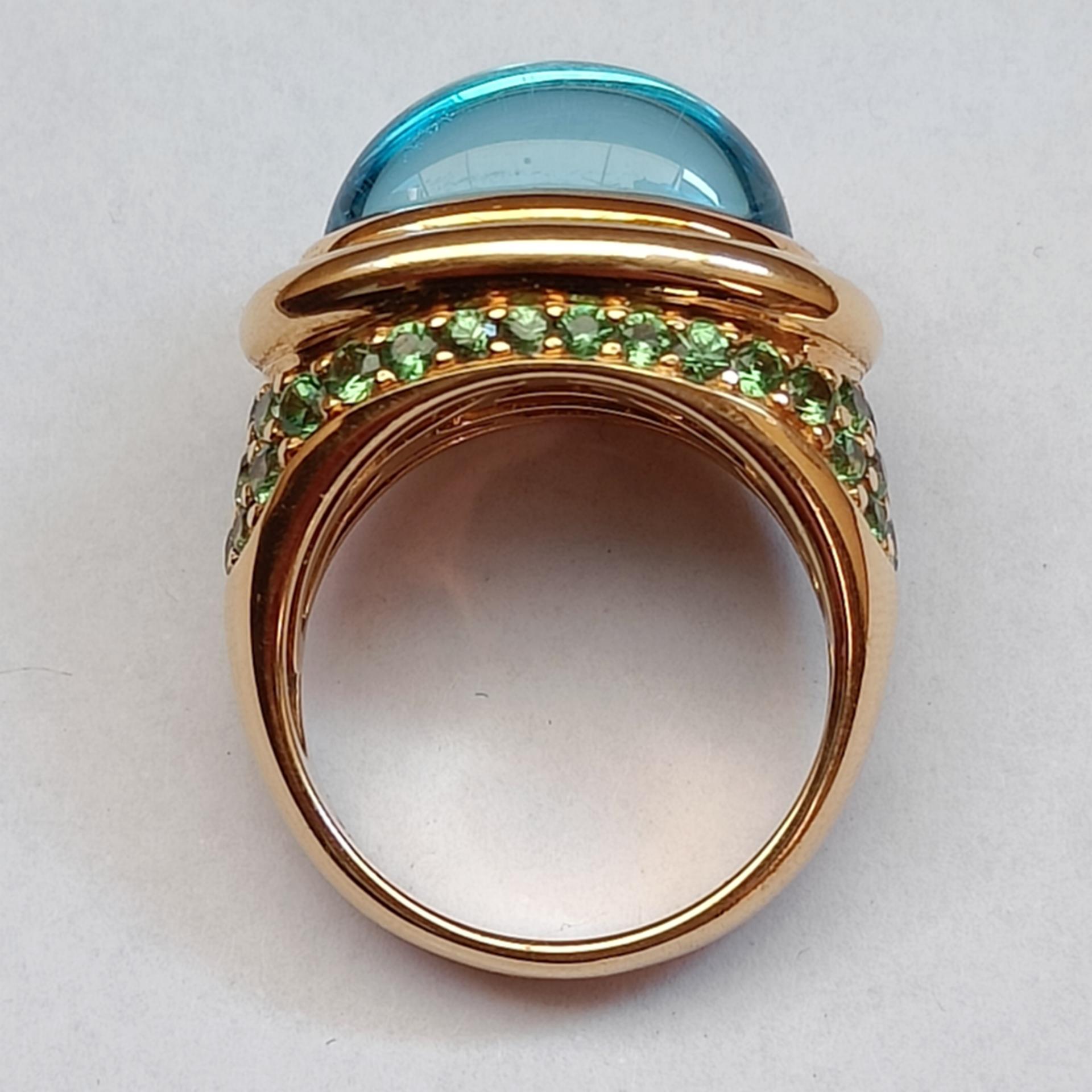 Contemporary 18k Gold Cocktail Ring with Blue Topaz Cabochon set with Tsavorites Pavé  For Sale