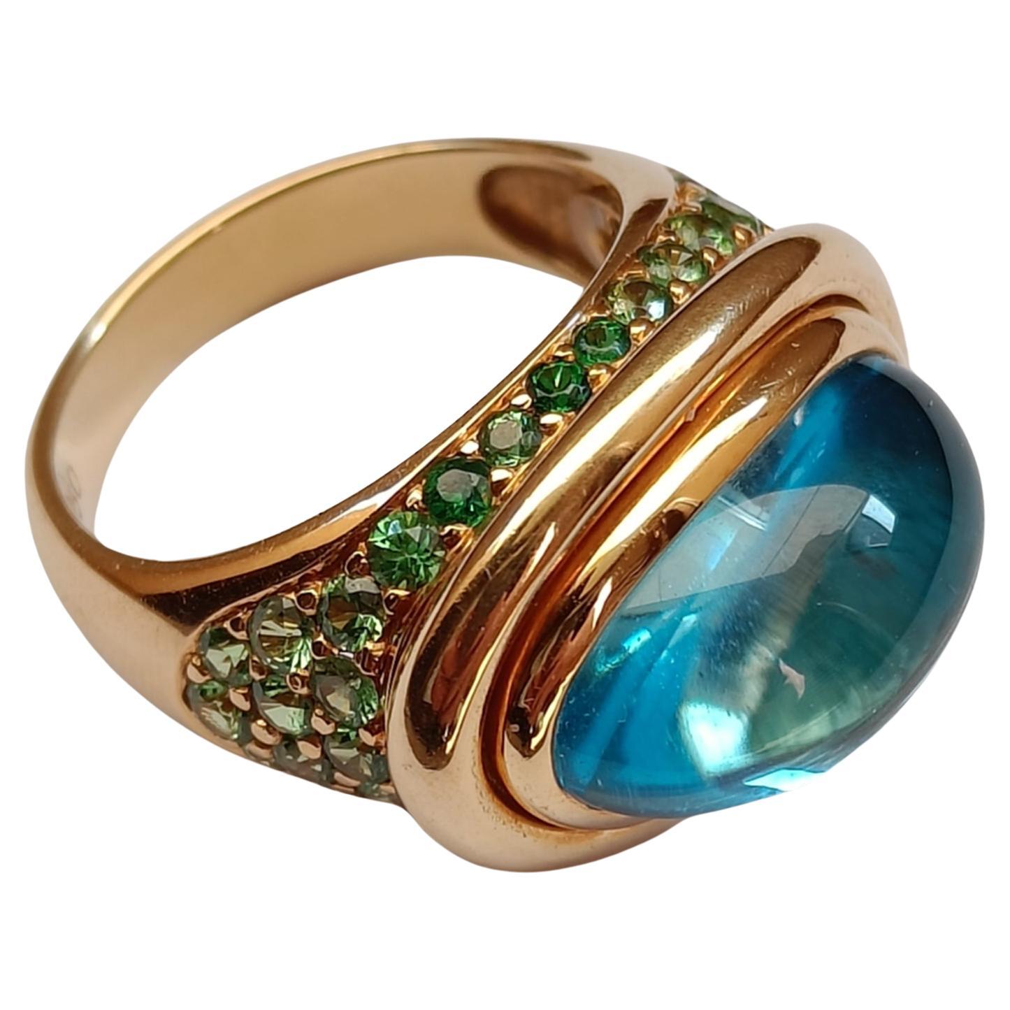 18k Gold Cocktail Ring with Blue Topaz Cabochon set with Tsavorites Pavé 