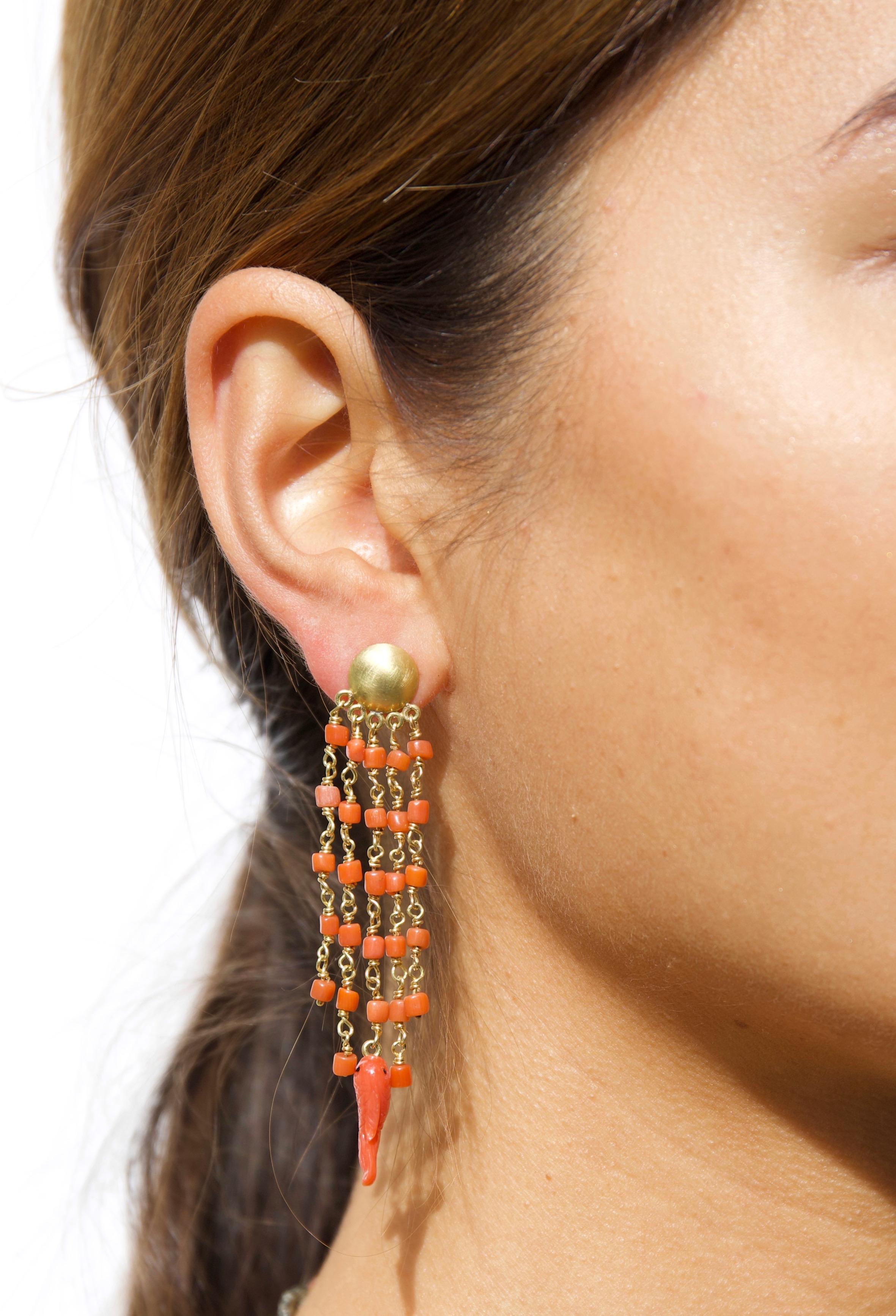 Make a statement with this lovely and summery pair of 18K gold chandelier earrings with coral beads and little hand-carved coral fish from Torre del Greco, Italy. A feminine and colourful touch to any wardrobe. 

Torre del Greco is a town in Italy