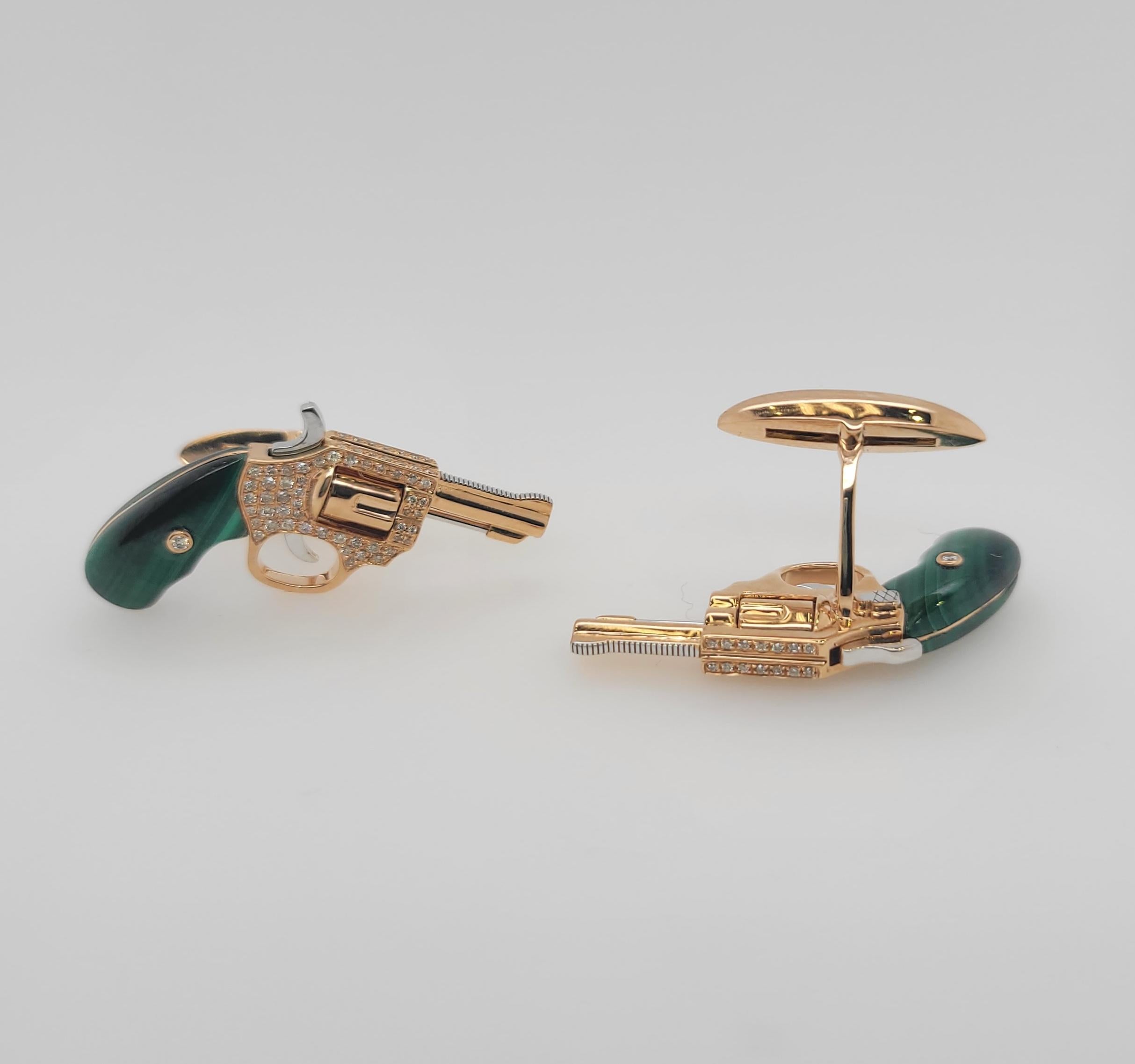 It's one of a kind Cufflinks. All parts are moving like a real gun. Enjoy the unique and special piece. In 18K Rose Gold engraved with F color Diamonds and Malachite natural healing stone. Currently we have black wood and white shell in stock . 
