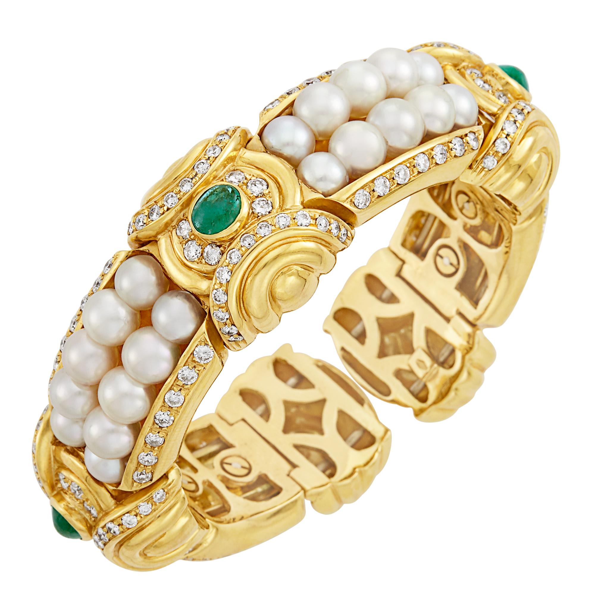 18kt., composed of double rows of 40 pearls approximately 6.3 to 5.3 mm., spaced by curved bombe stations centering 3 oval cabochon emeralds, framed and edged by 152 round diamonds approximately 5.15 ct., approximately 69 dwts. gross. Inner circle 6